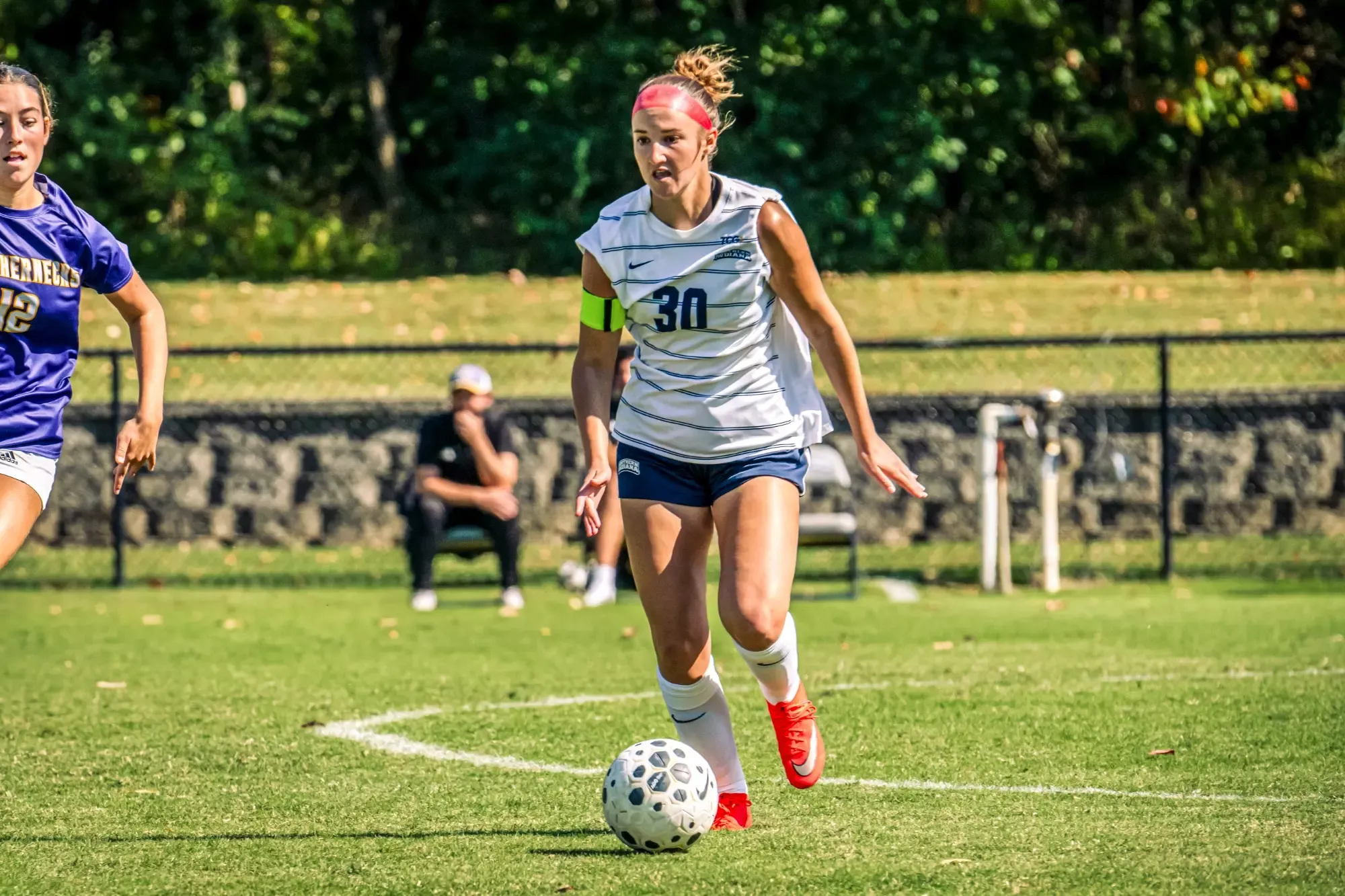 USI Women's Soccer Kamryn Bea dribbling the ball against Western Illinois.