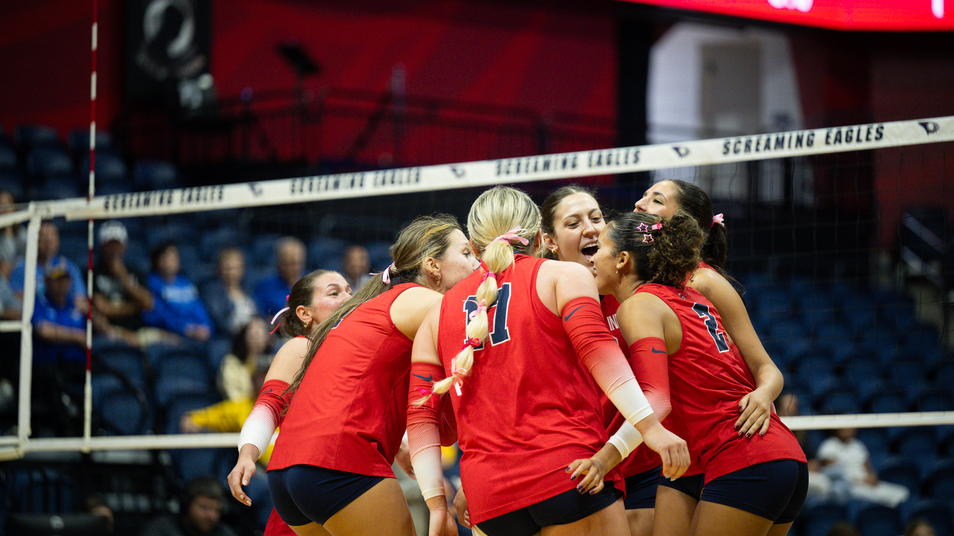 USI VB vs MSU Pink Day team huddle
