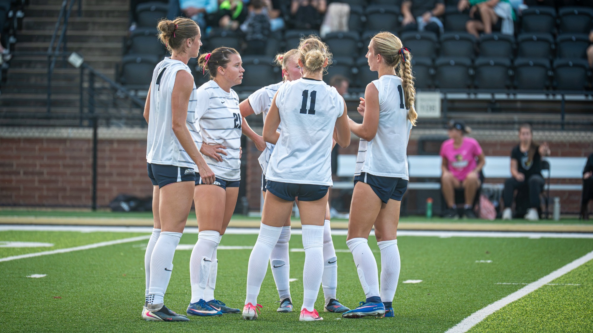 USI Women's Soccer group huddle in game at Lindenwood.