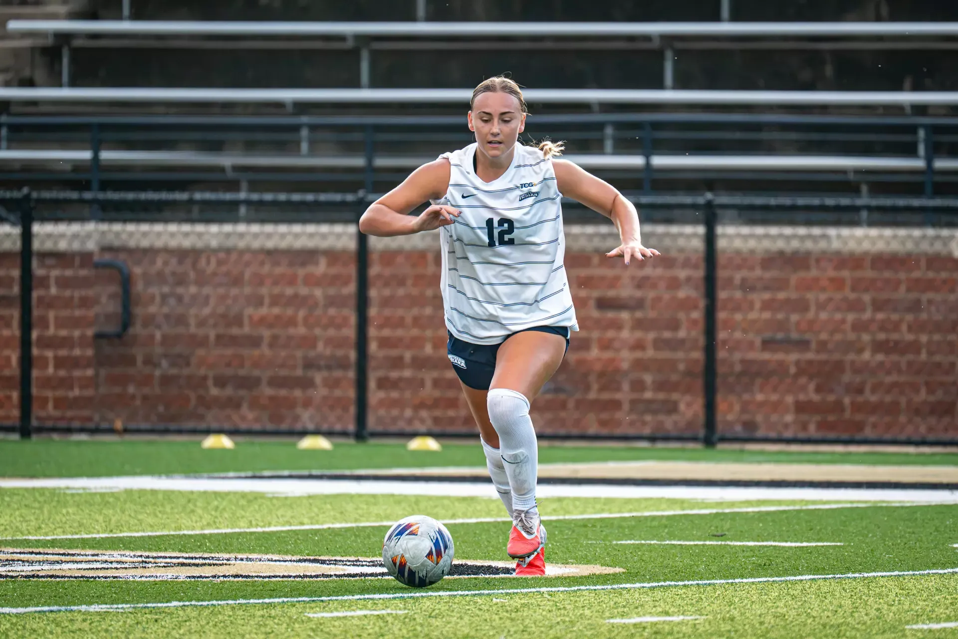 USI Women's Soccer Ava Hess dribbling the ball against Lindenwood.