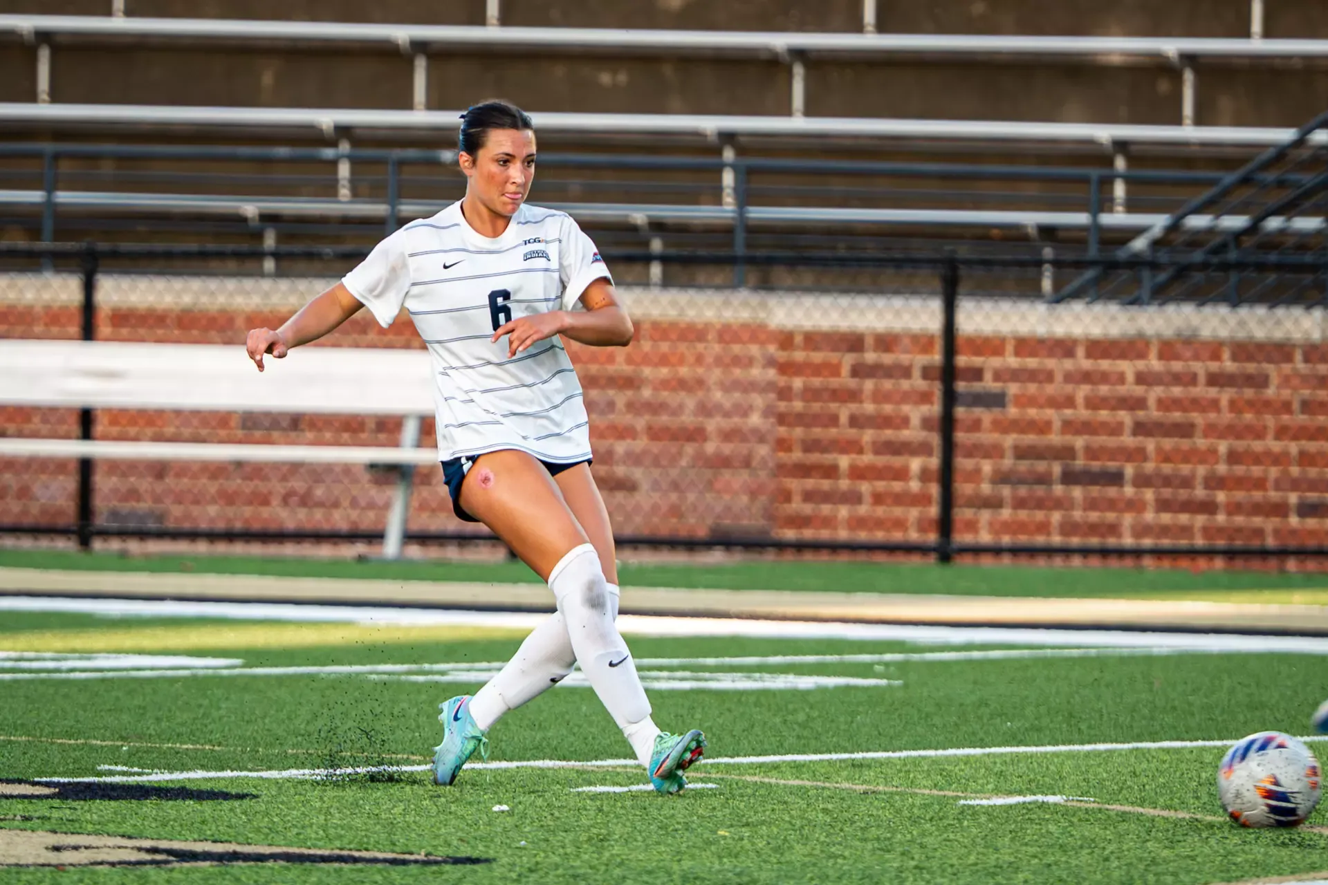 USI Women's Soccer Emma Schut kicking the ball against Lindenwood.