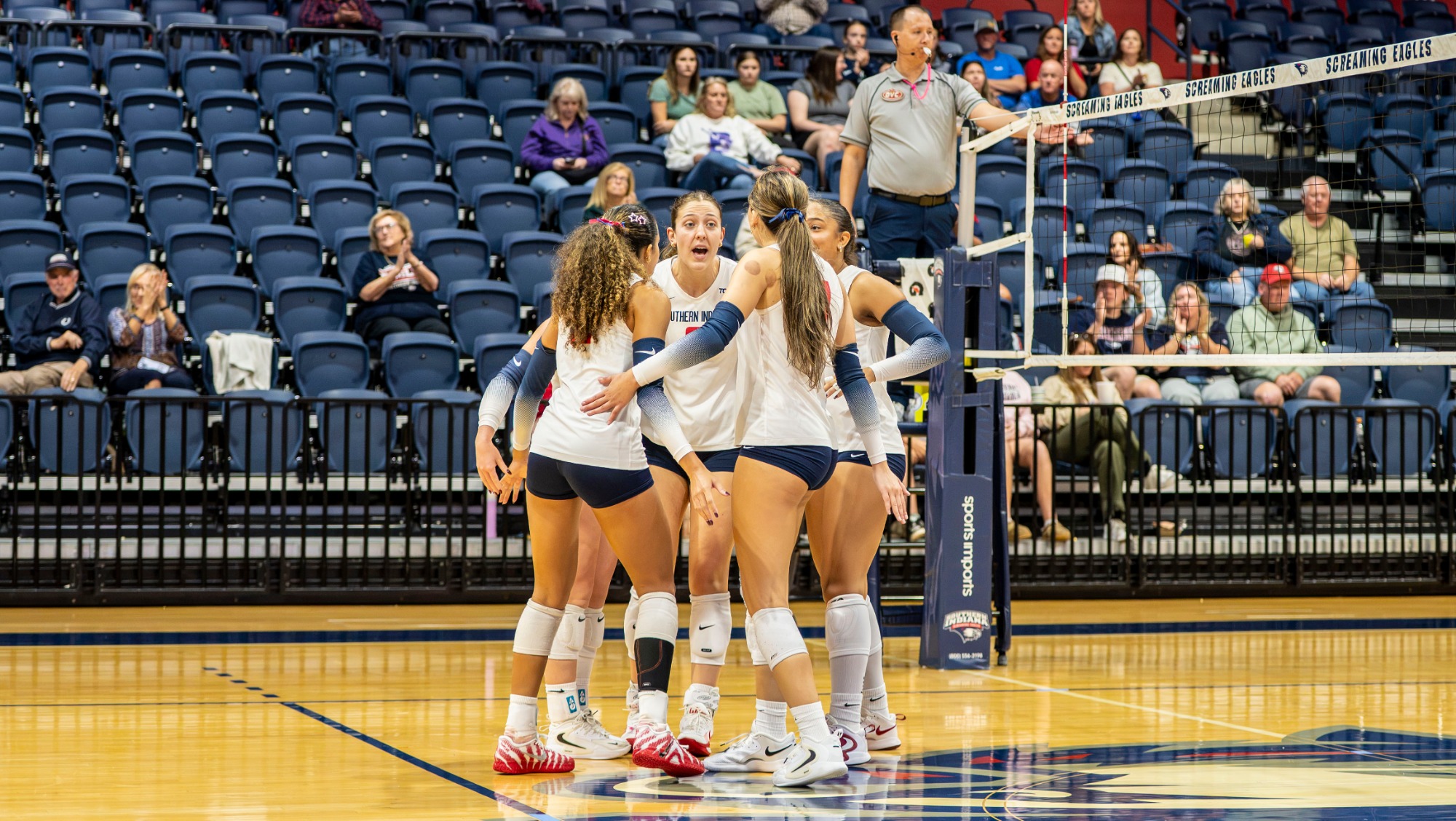 USI VB vs WIU team huddle