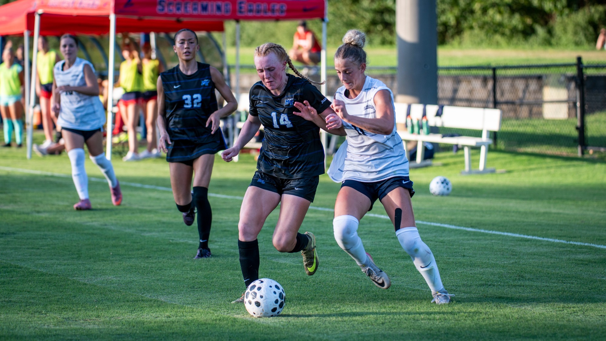 USI Women's Soccer midfielder Liza Anderson battles for ball against Middle Tennessee.