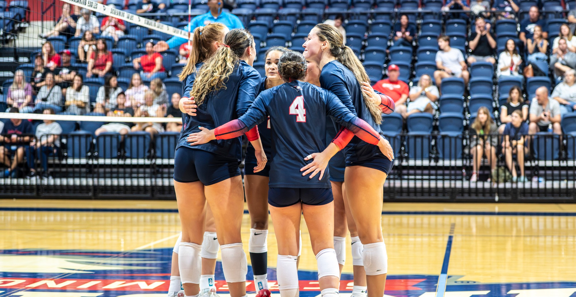 USI VB team huddle