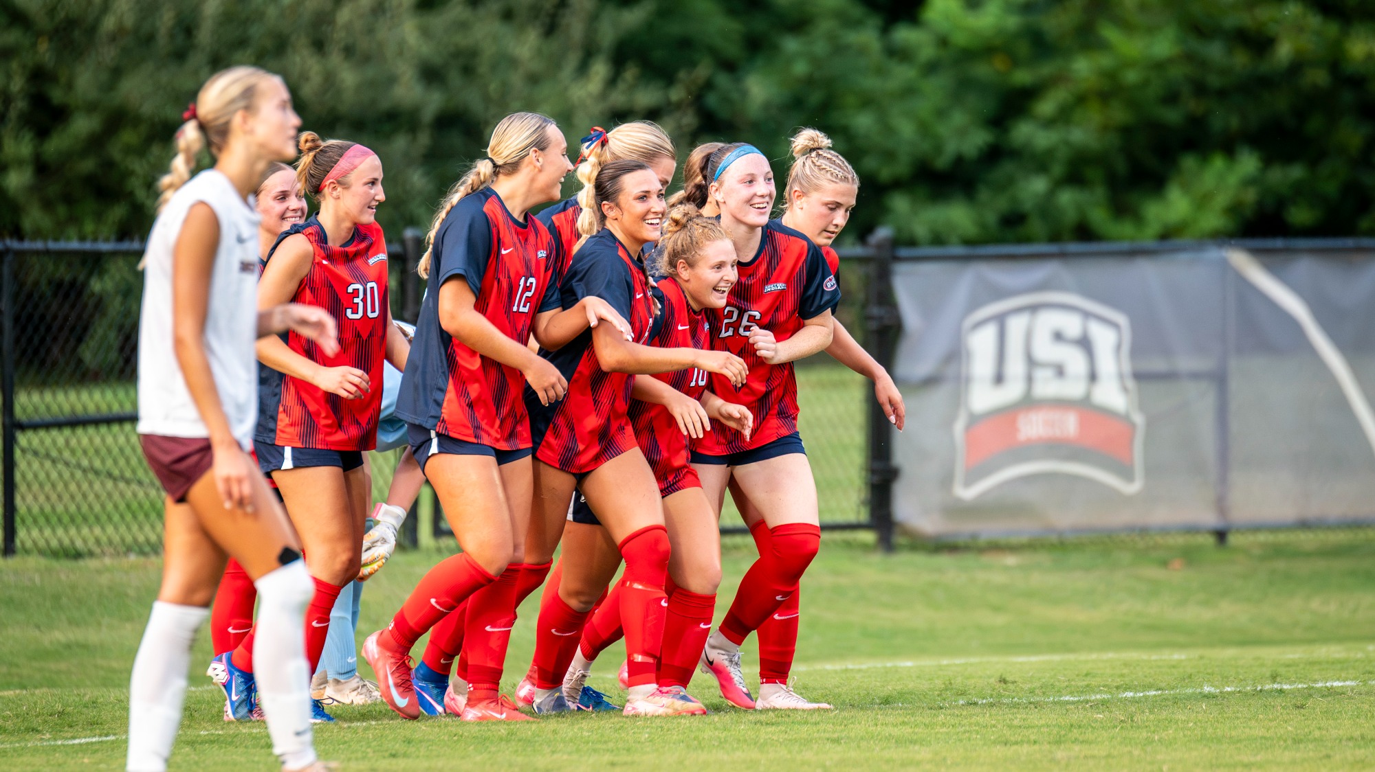 USI Women's Soccer exhibition vs. Bellarmine team celebration after scoring a goal