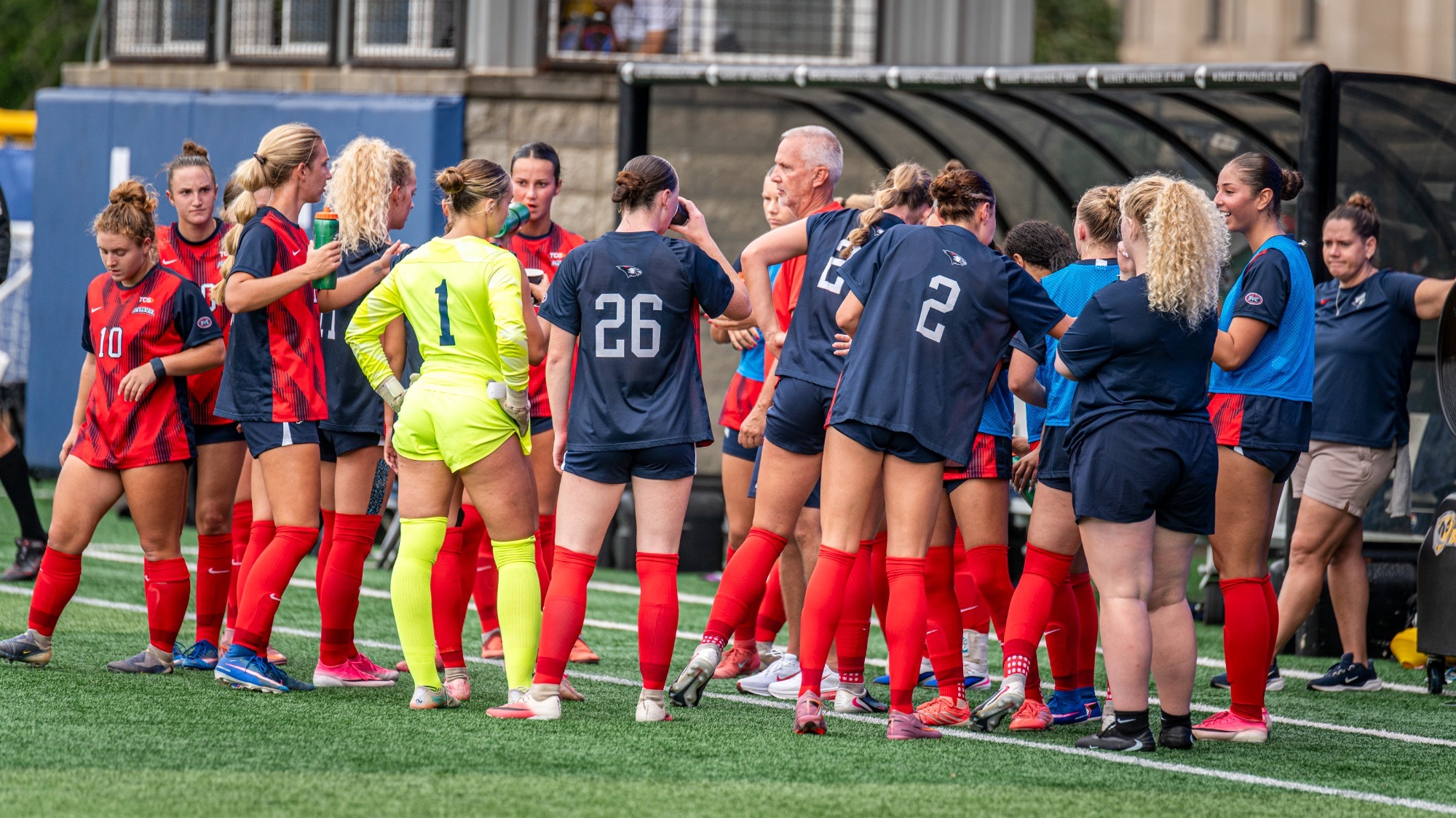 USI Women's Soccer talking in a huddle against DePaul.