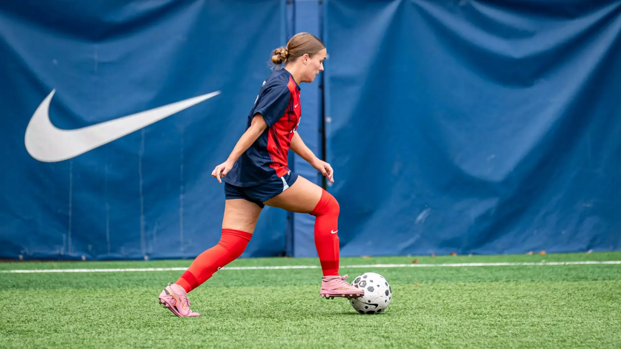USI Women's Soccer vs. DePaul Josie Pochocki dribbling the ball.
