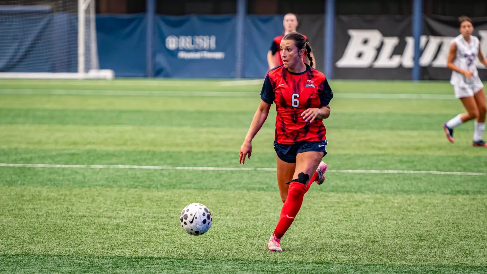 USI Women's Soccer vs. DePaul Emma Schut dribbling the ball.