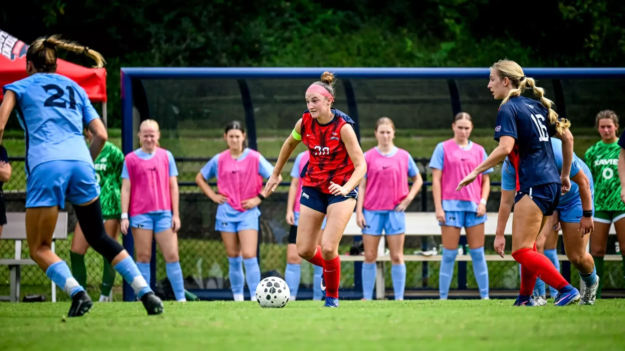 USI Women's Soccer Kamryn Bea dribbling the ball against Xavier.