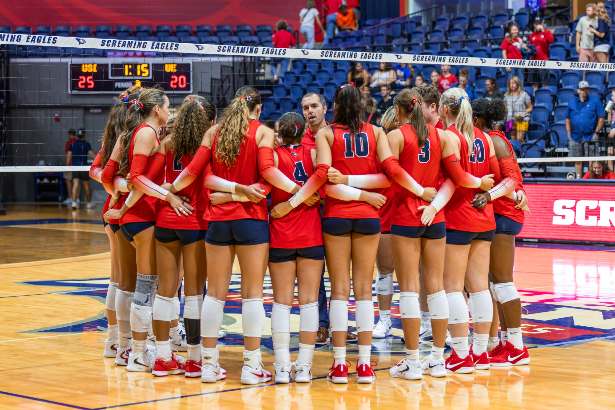USI VB vs UE team huddle