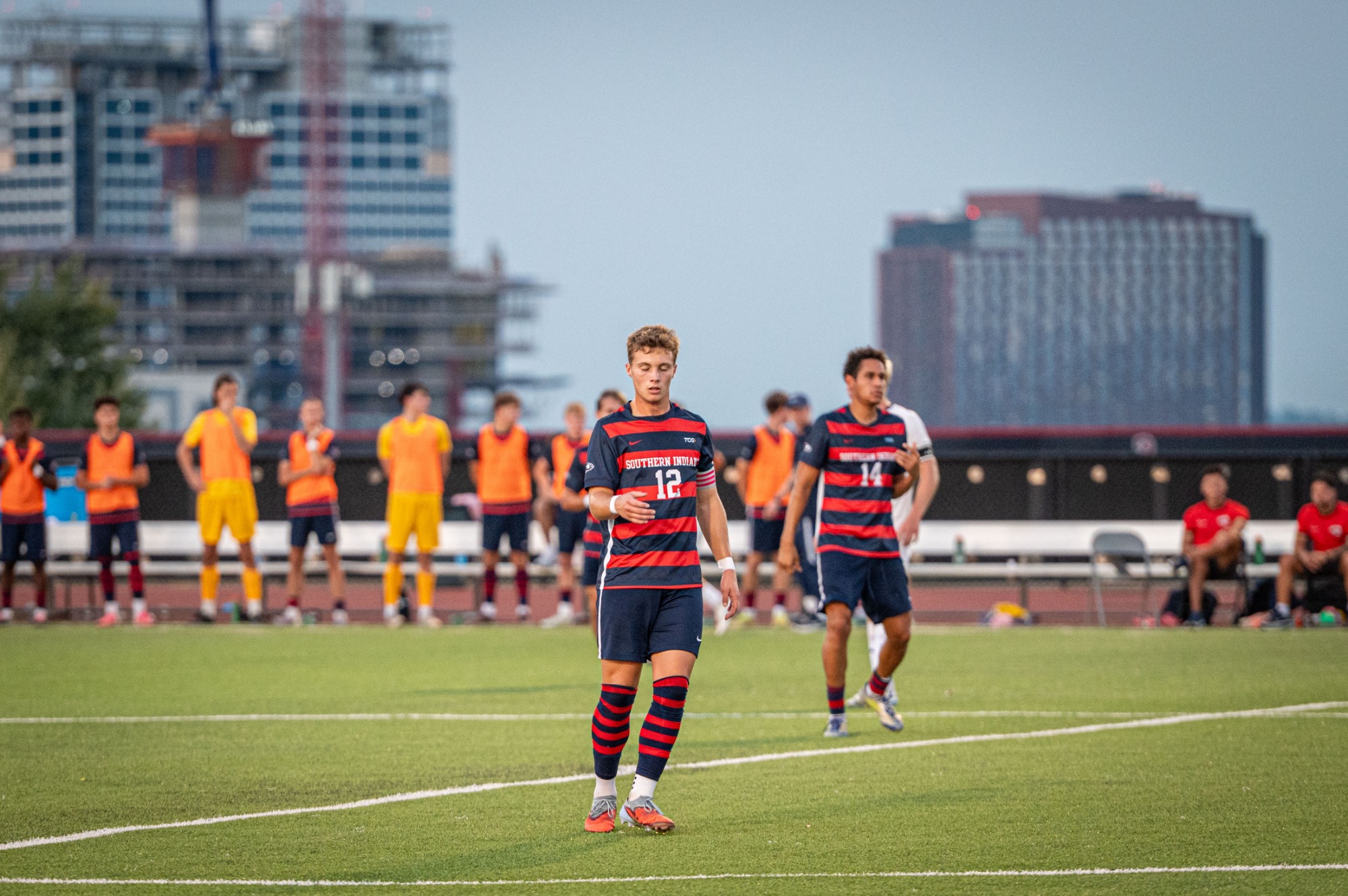 Nolan Stevens stands in front of the skyline
