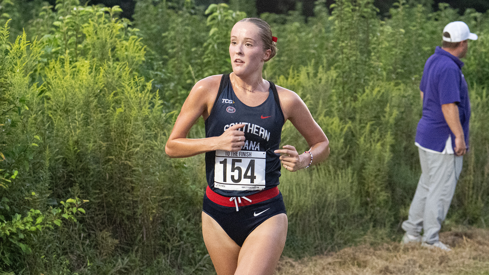 Ellie Hall races to a first-place finish at the 2026 Stegemoller Screagle Twilight at the USI Cross Country Course in Evansville, Indiana, on September 4.