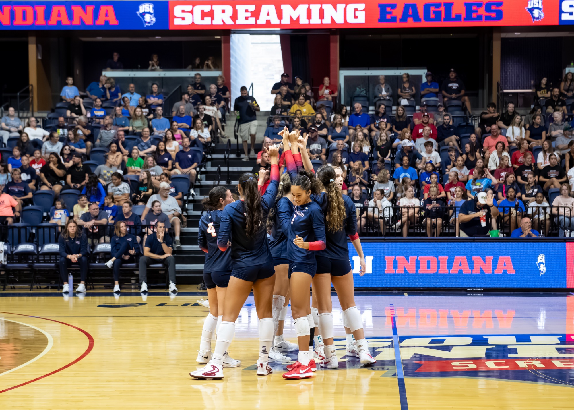 USI VB vs IU team huddle