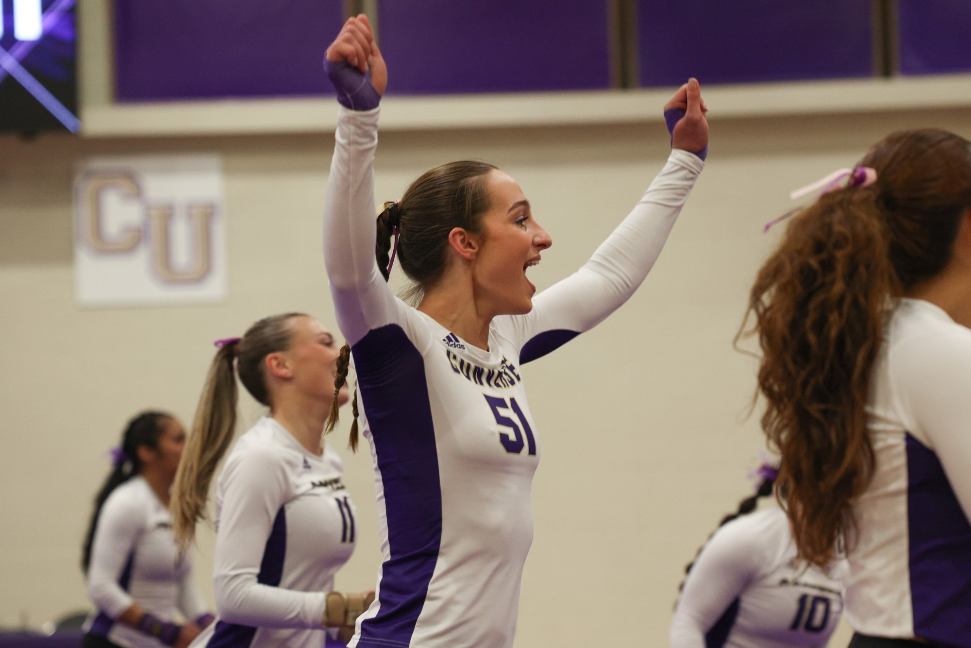 Kaylah Belle Danjczek celebrates on the matts