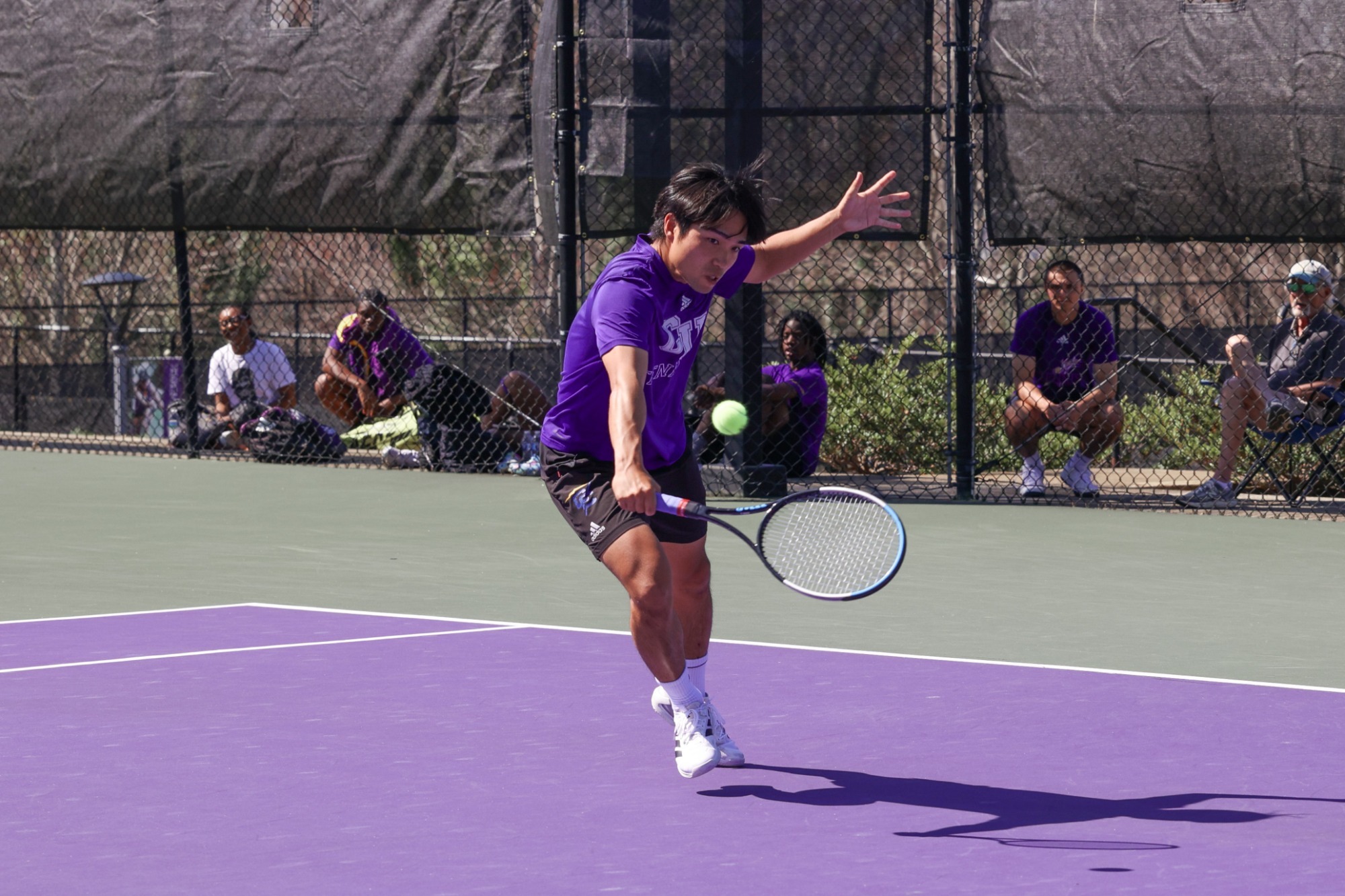 Takuma Furumaki returns a ball
