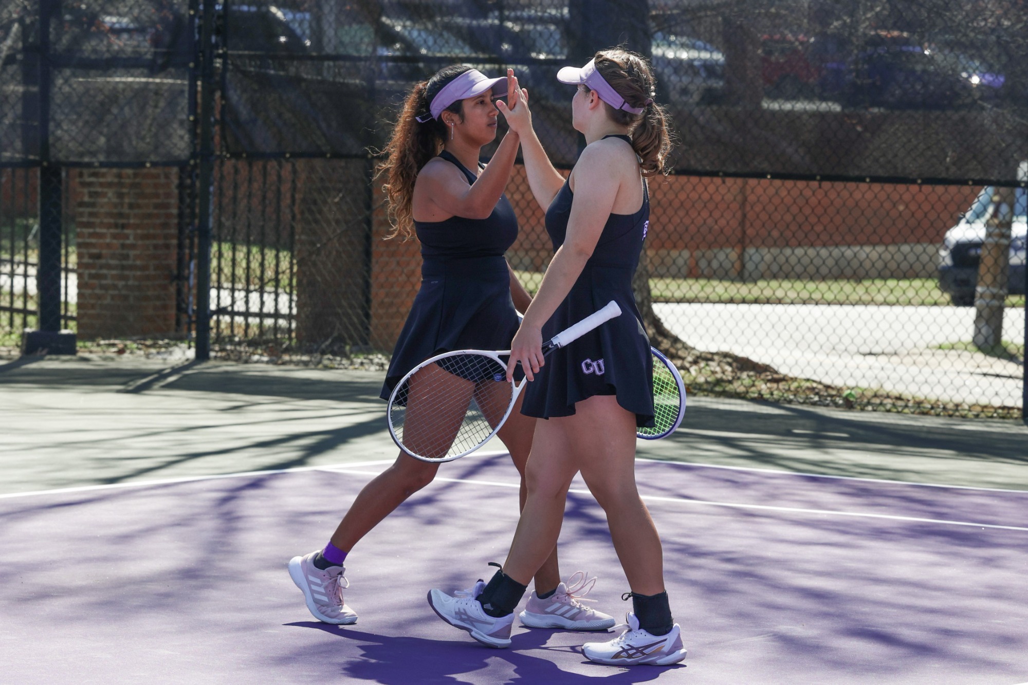 Tamanna and Romy high five