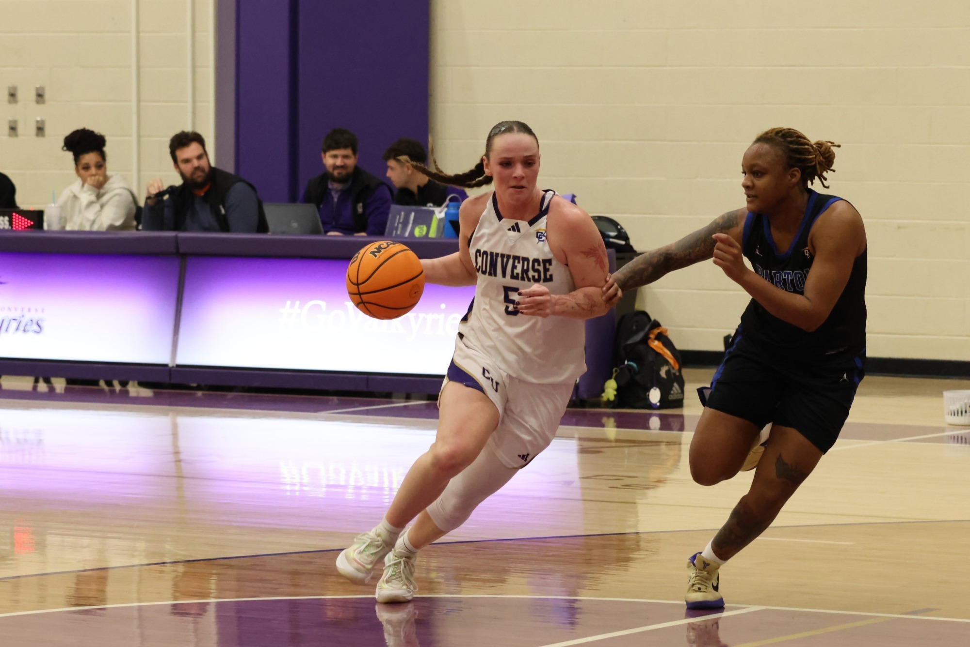 Mazie Helpman dribbles past a defender
