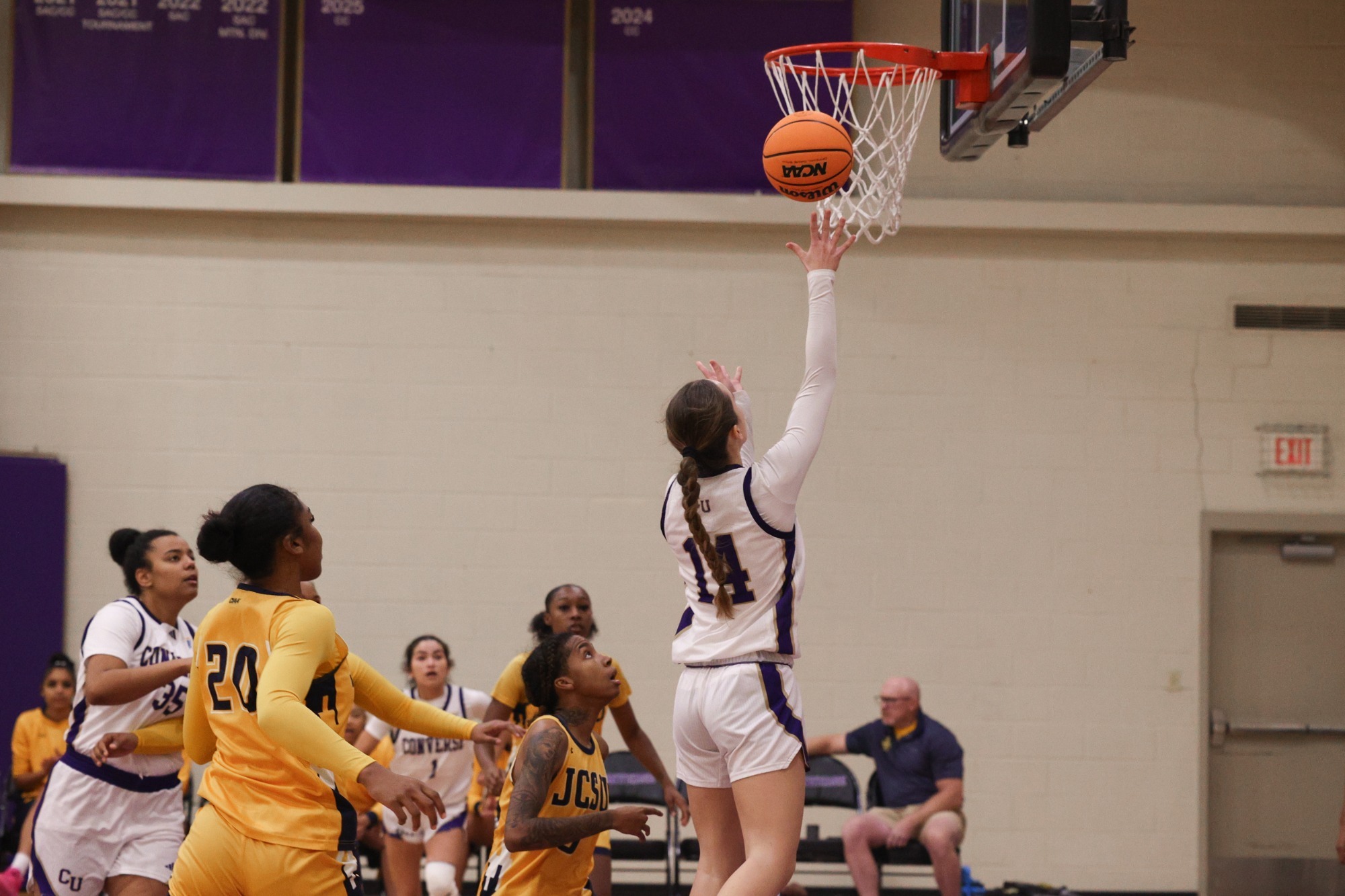ACG goes for a layup against JCSU