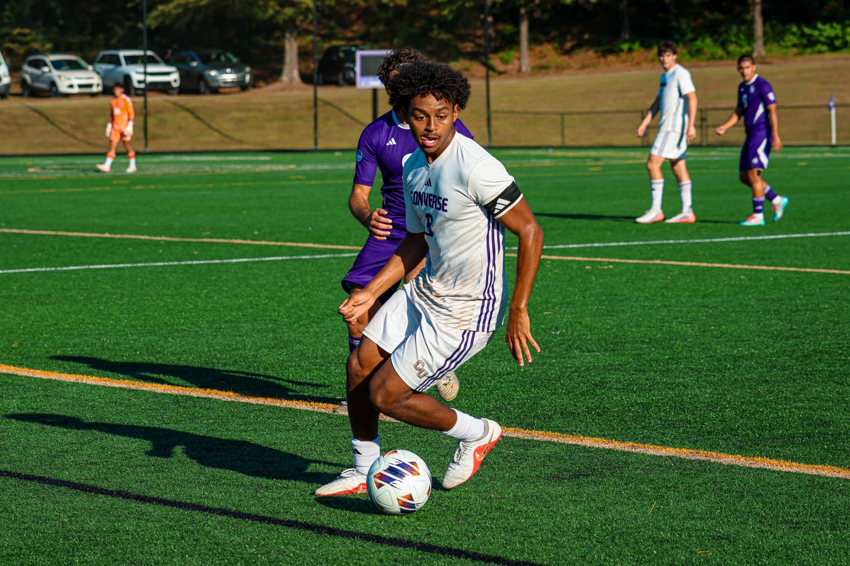Amro Shibeika dribbles around a YHC defender