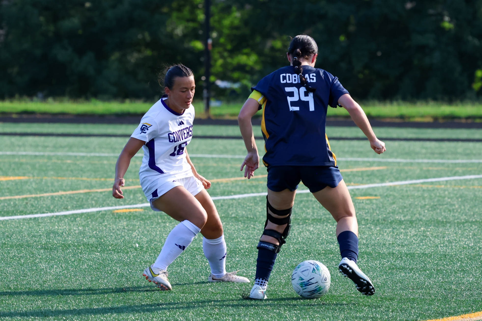 Brianna Berry looks to stop a Coker forward