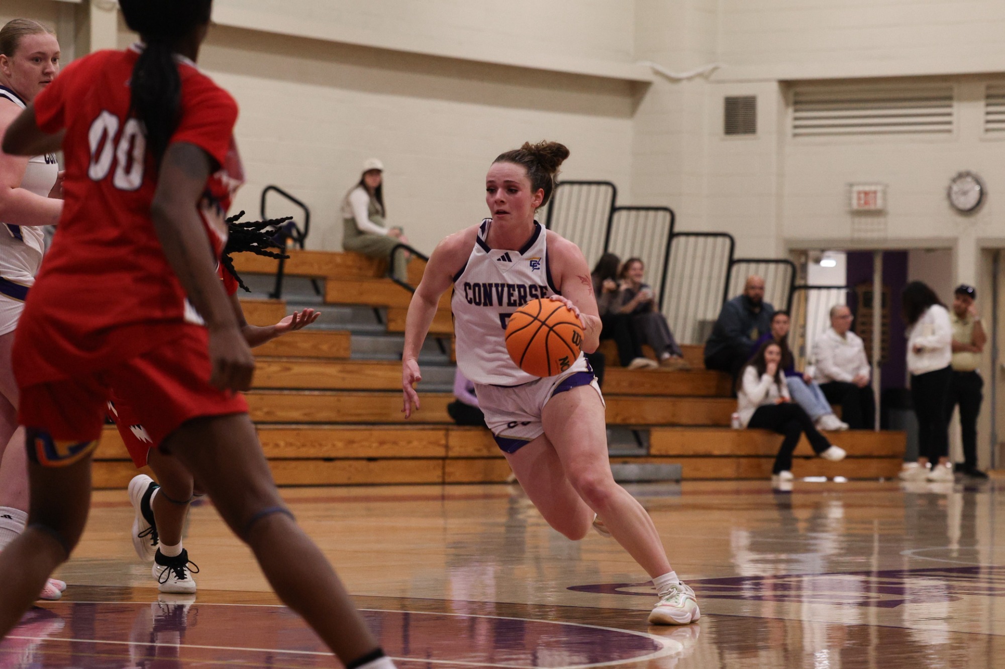 Mazie Helpman dribbles past FMU defenders