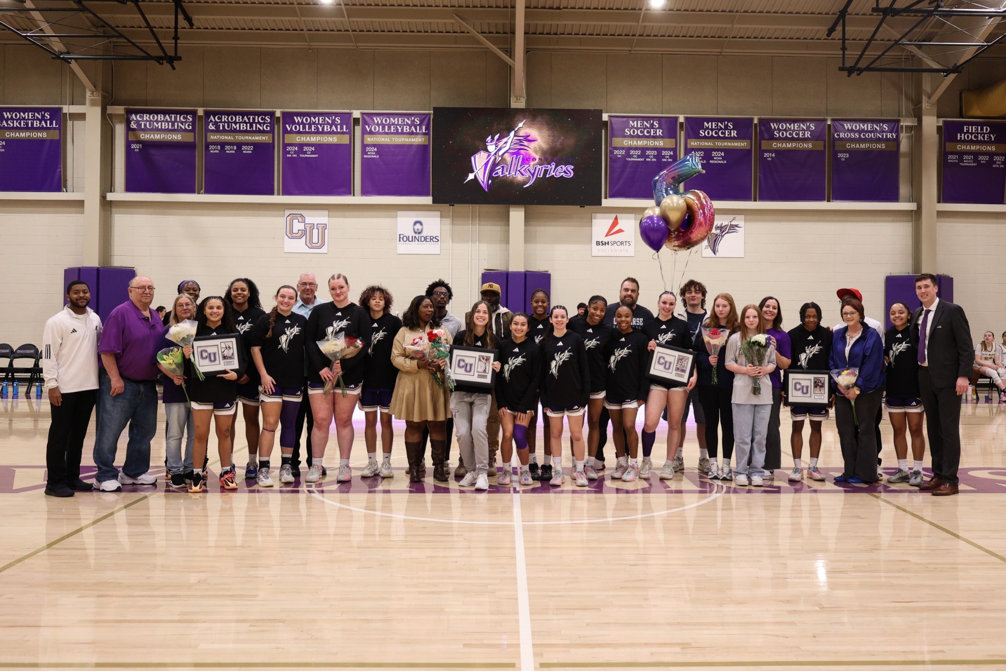 The 2026 Converse women's basketball team poses during senior day