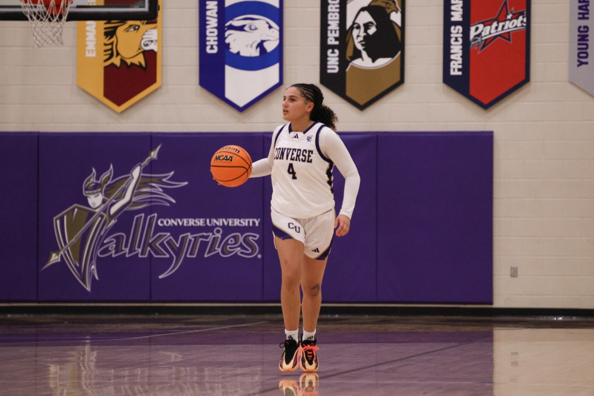 Alexis Becker dribbles in the Weisiger Center