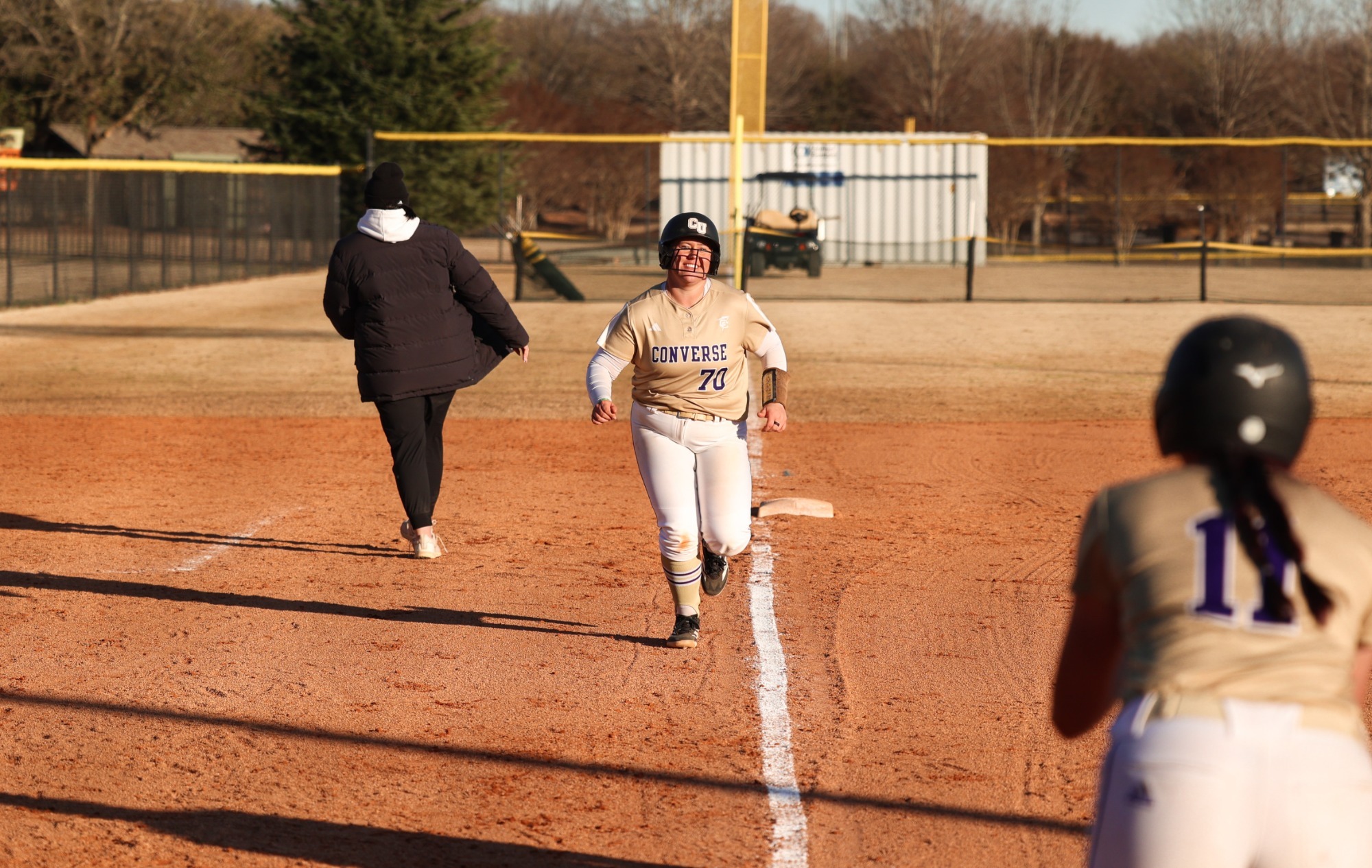 Madison Davis rounds third heading for home after a home run