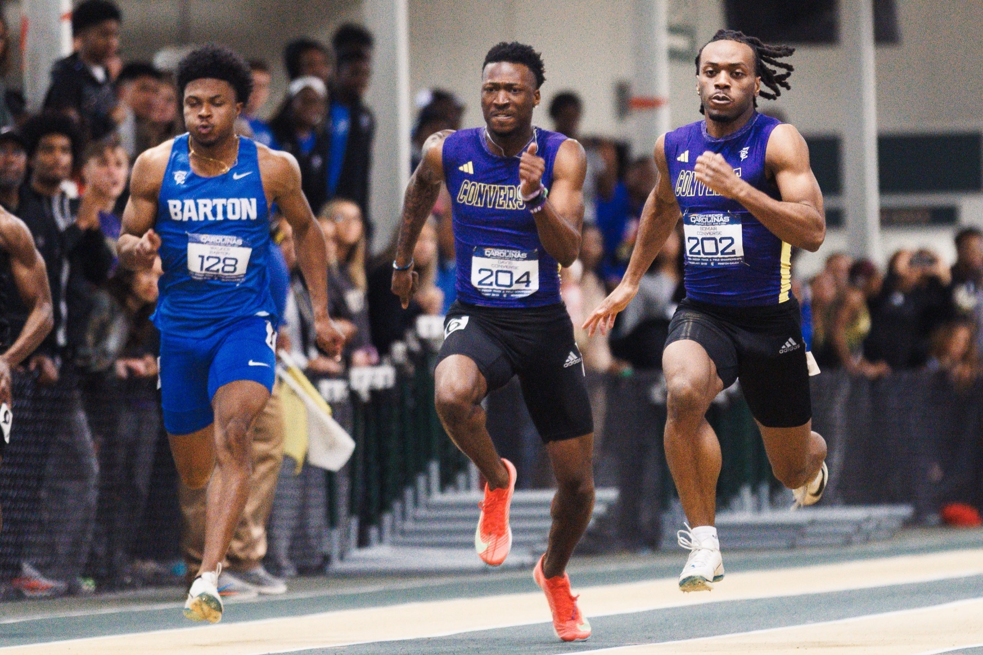 Devron Davis, flanked by Dorian Bomar on the right, runs the 60-meter dash at CC Indoor Championships