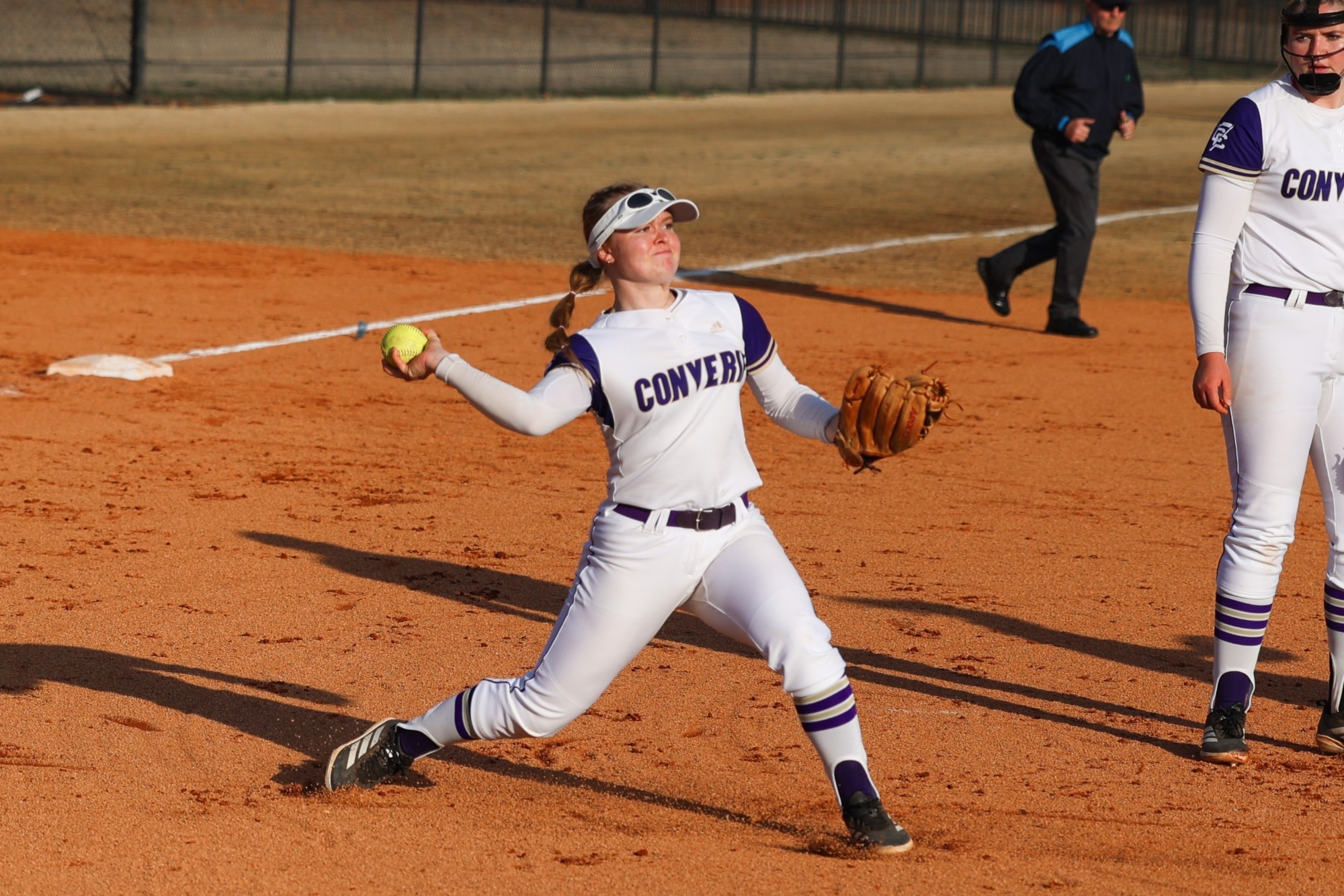 Olivia Jones throws a ball from third base