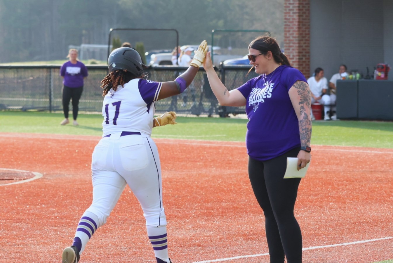 Kiarra Thomas rounds third base for her record-tying 21st career home run