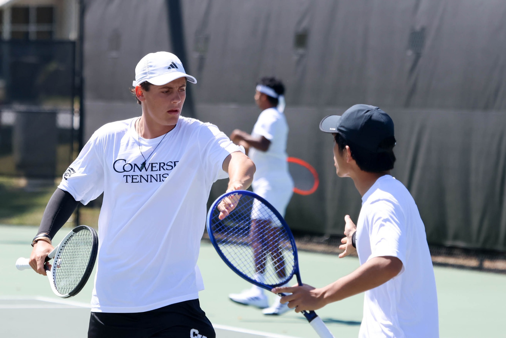 Ben Hyde-Smith and Takuma Furumaki high five on the court