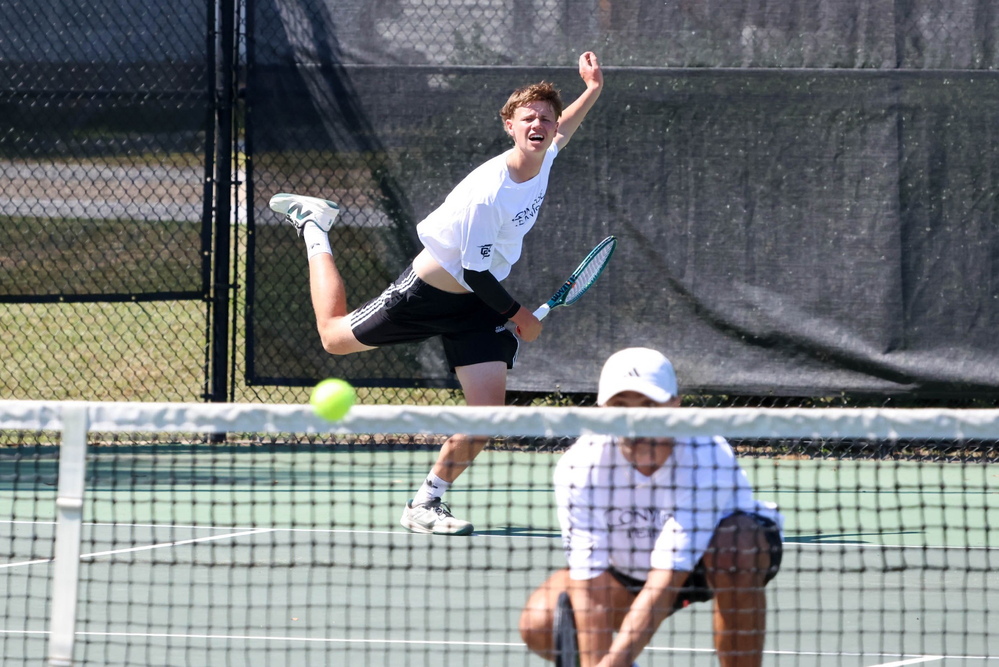 Patrick Flood serves the ball towards the camera