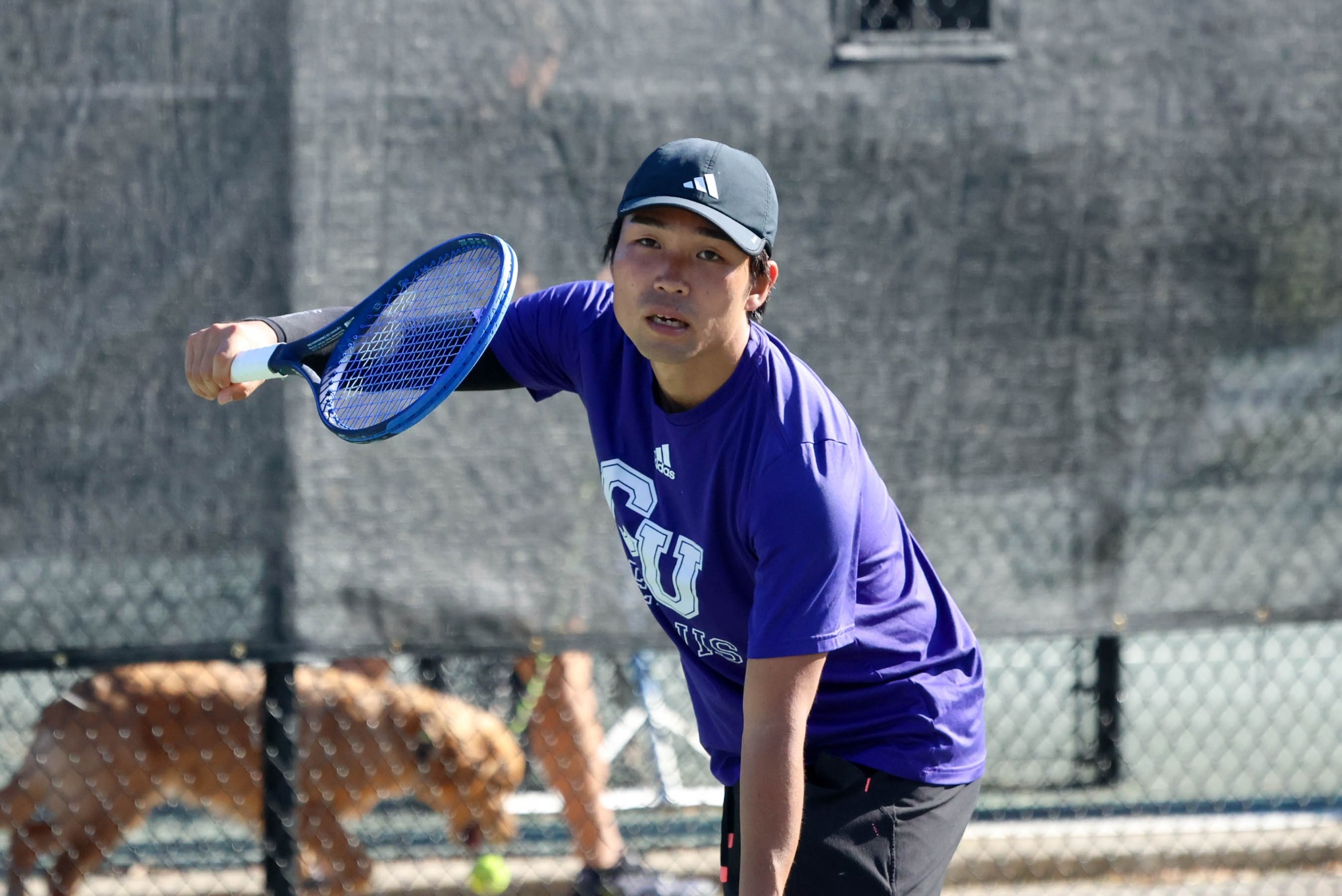 Takuma Furumaki begins his serve