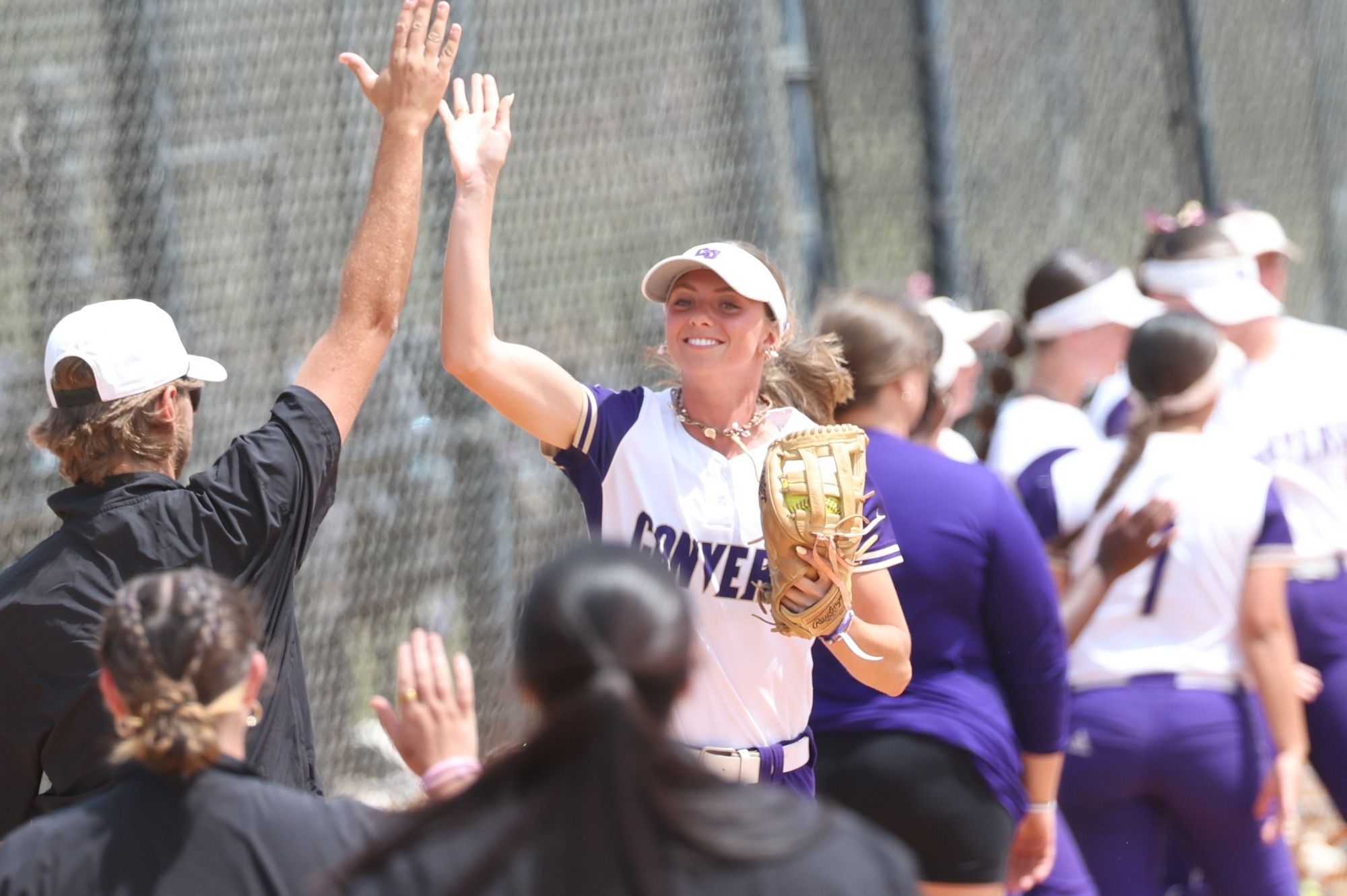 Aubree Leonard jumps for a pregame high five during starting lineups against SWU