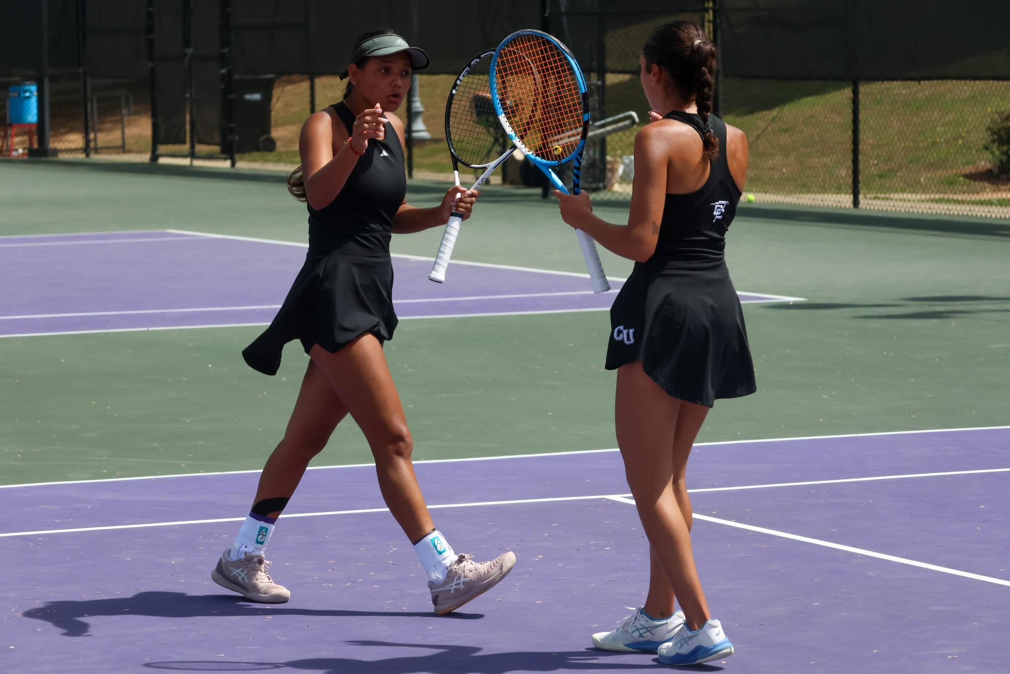 Khushi Kharb and Lais Martins high five on the court