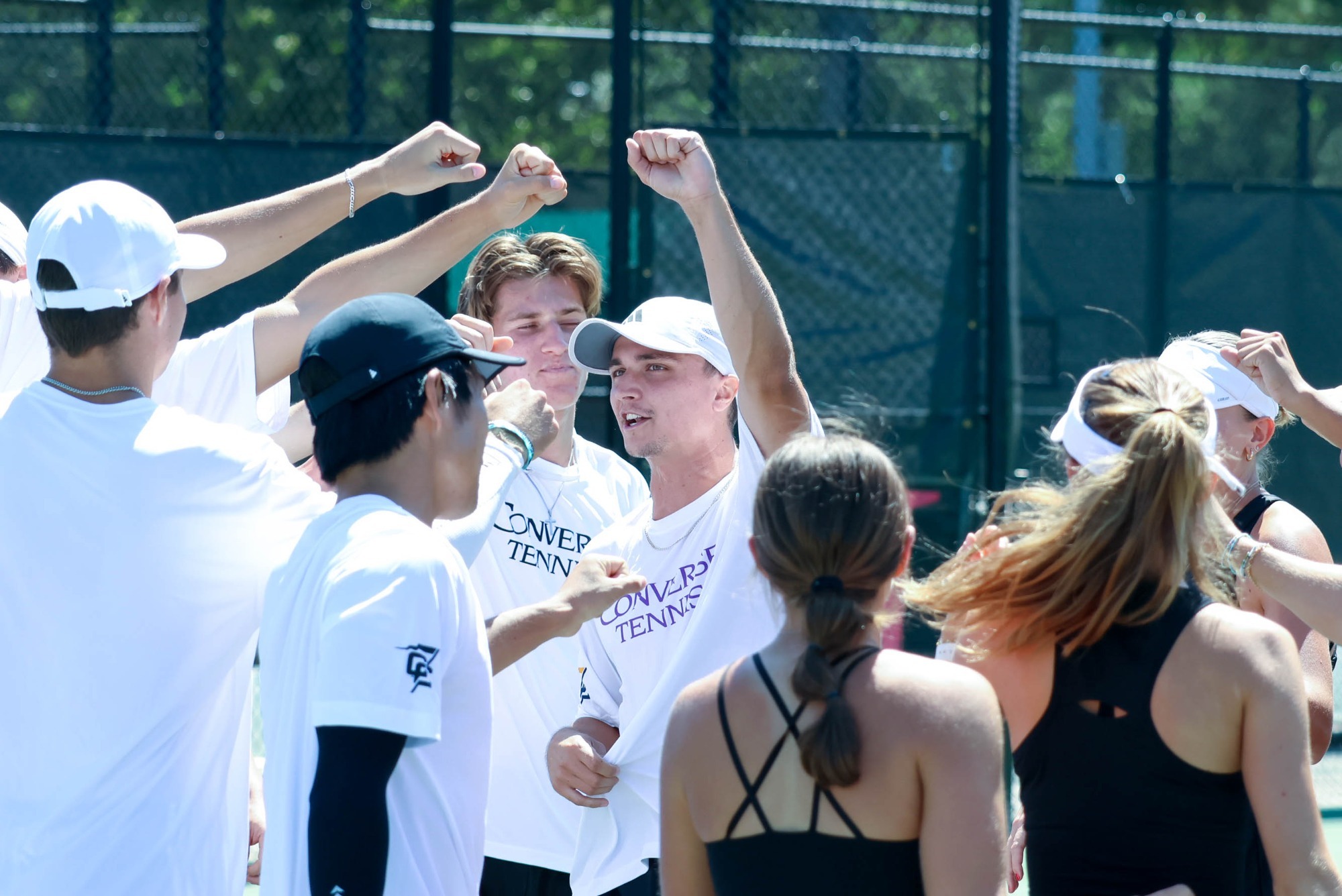 Parker Davis raises his fist during a prematch team huddle