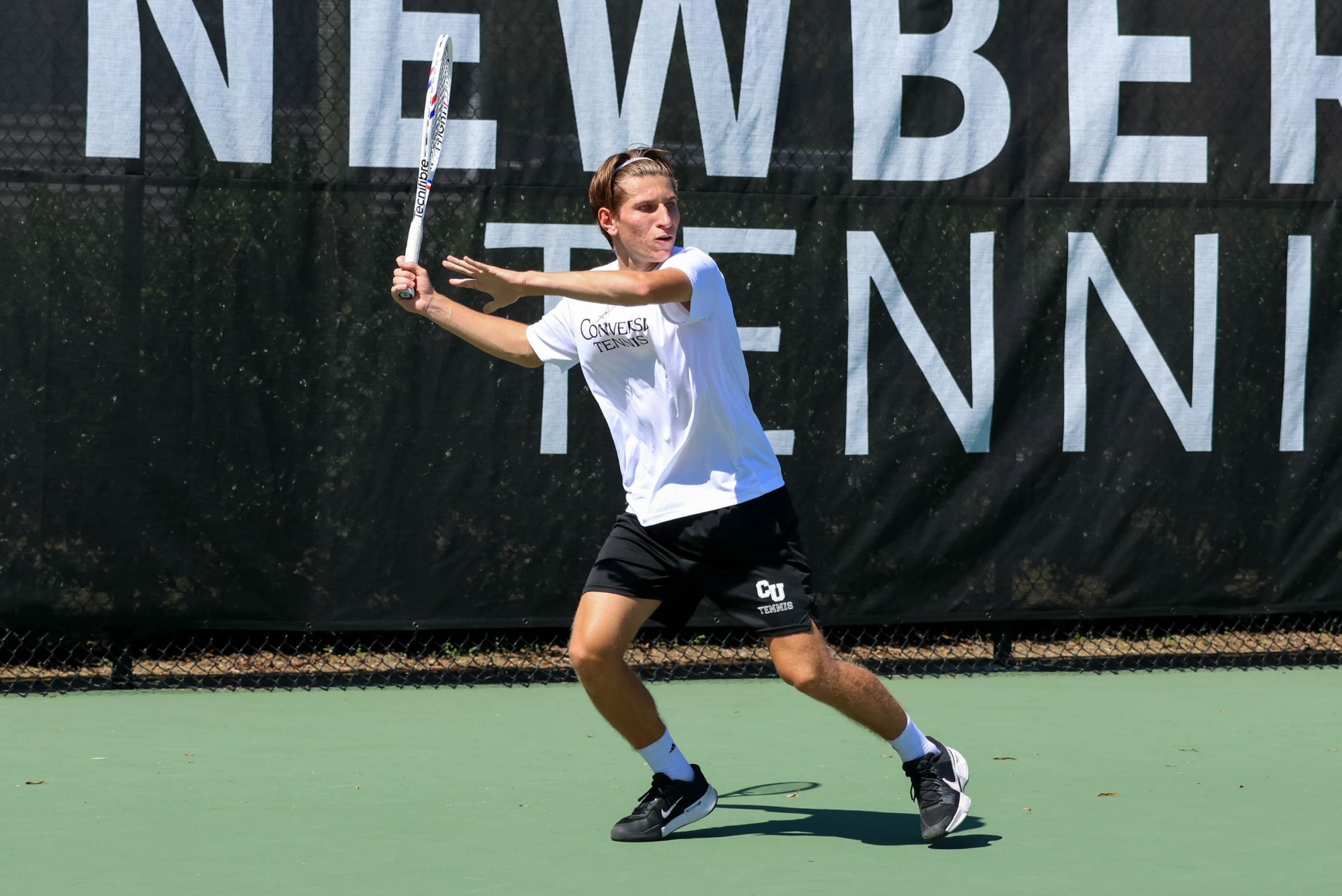 Mathis Blary prepares to hit a forehand against Newberry