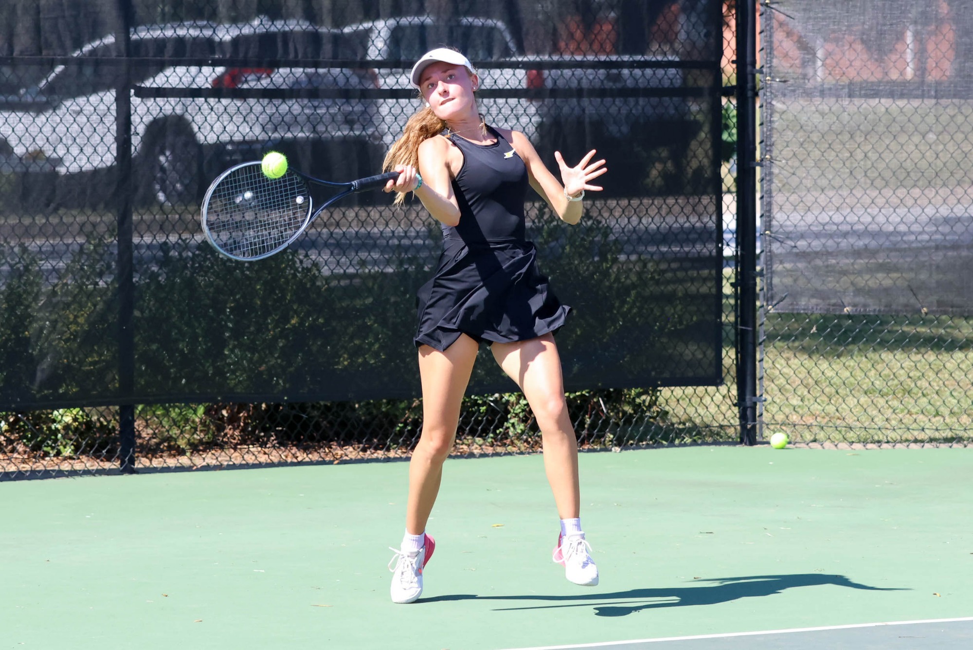 Camille Lacombe returns a forehand against Newberry