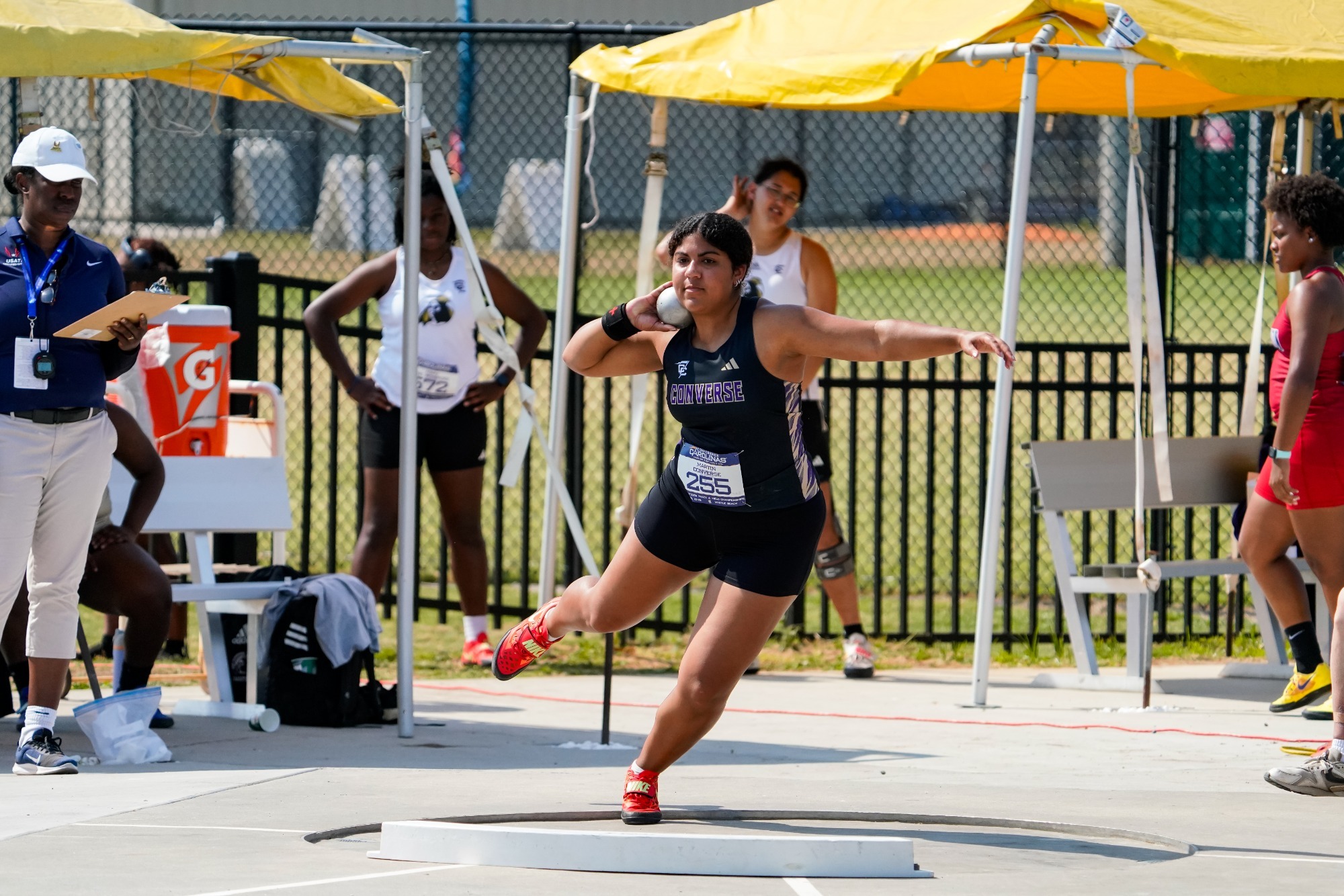 Bella Martin competes in the shot put at the CC Outdoor Championships
