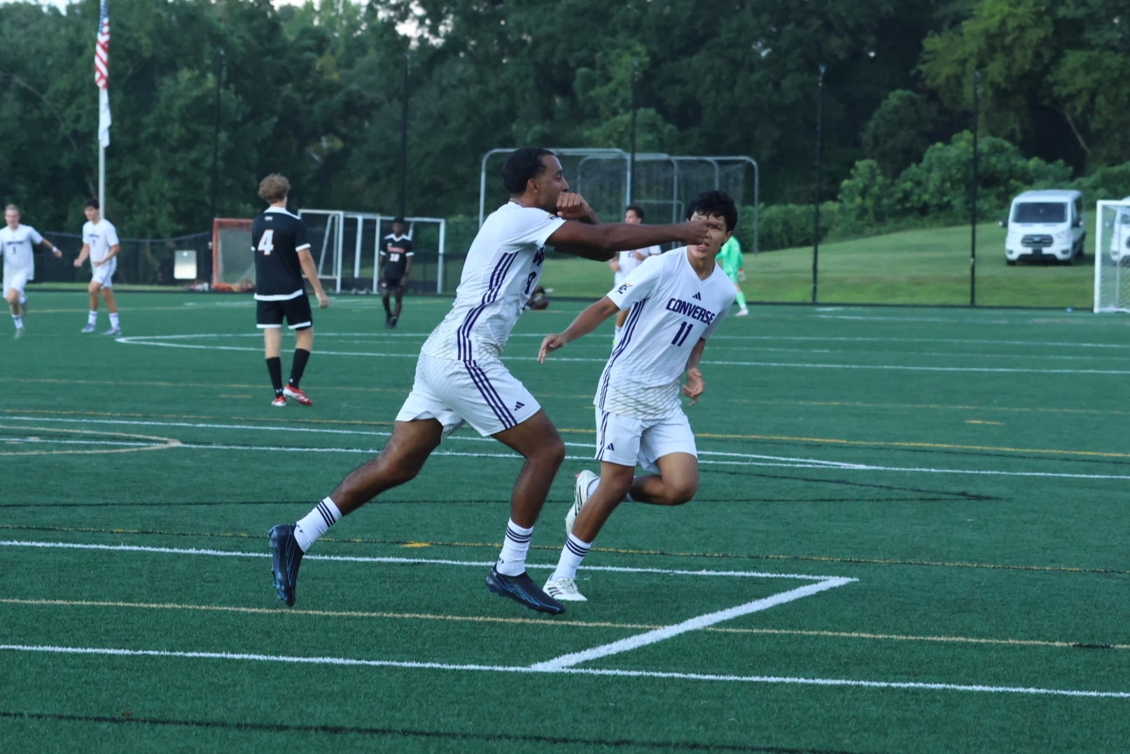 Kade Smith and Andy Alvarenga celebrate a goal on the field