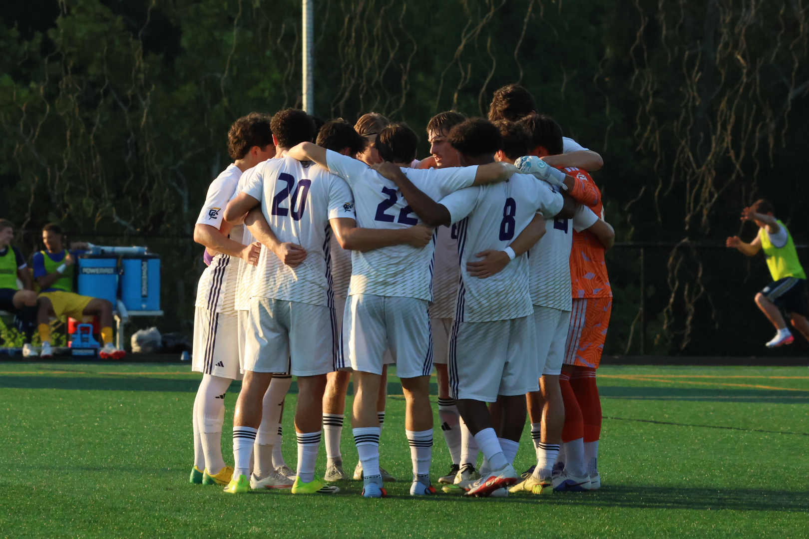 The Converse men's soccer team huddles prior to their match with Wingate