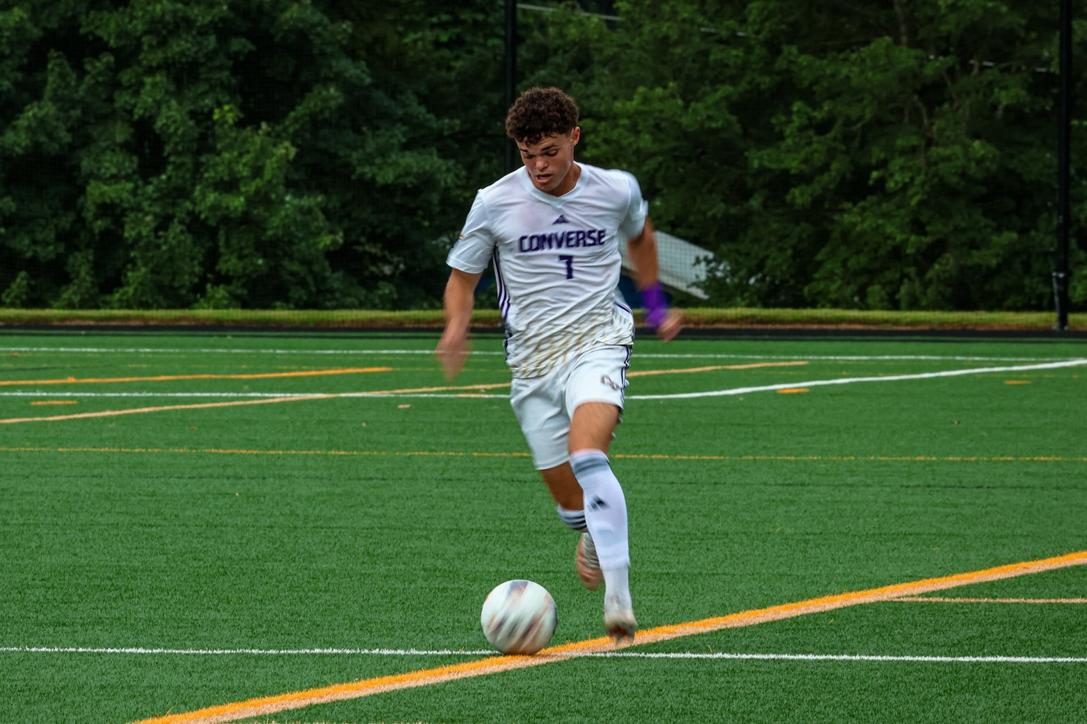 Levi Bankirer dribbles the ball up the sideline at Weisiger Stadium