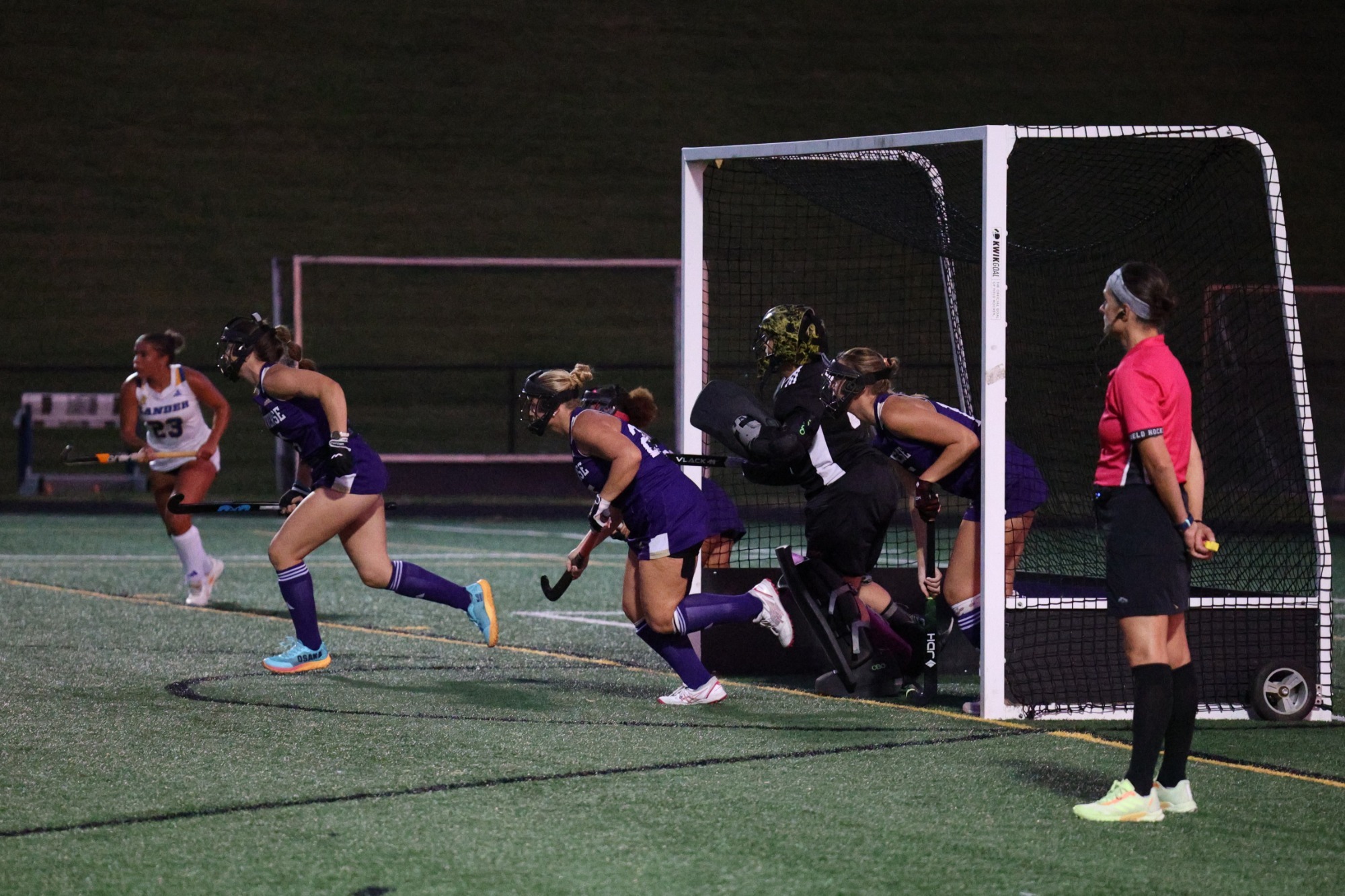 The Converse defense goes out for a corner against Lander