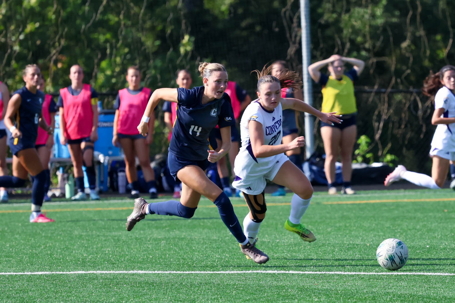 Charlie Morgan fights with a defender for the ball