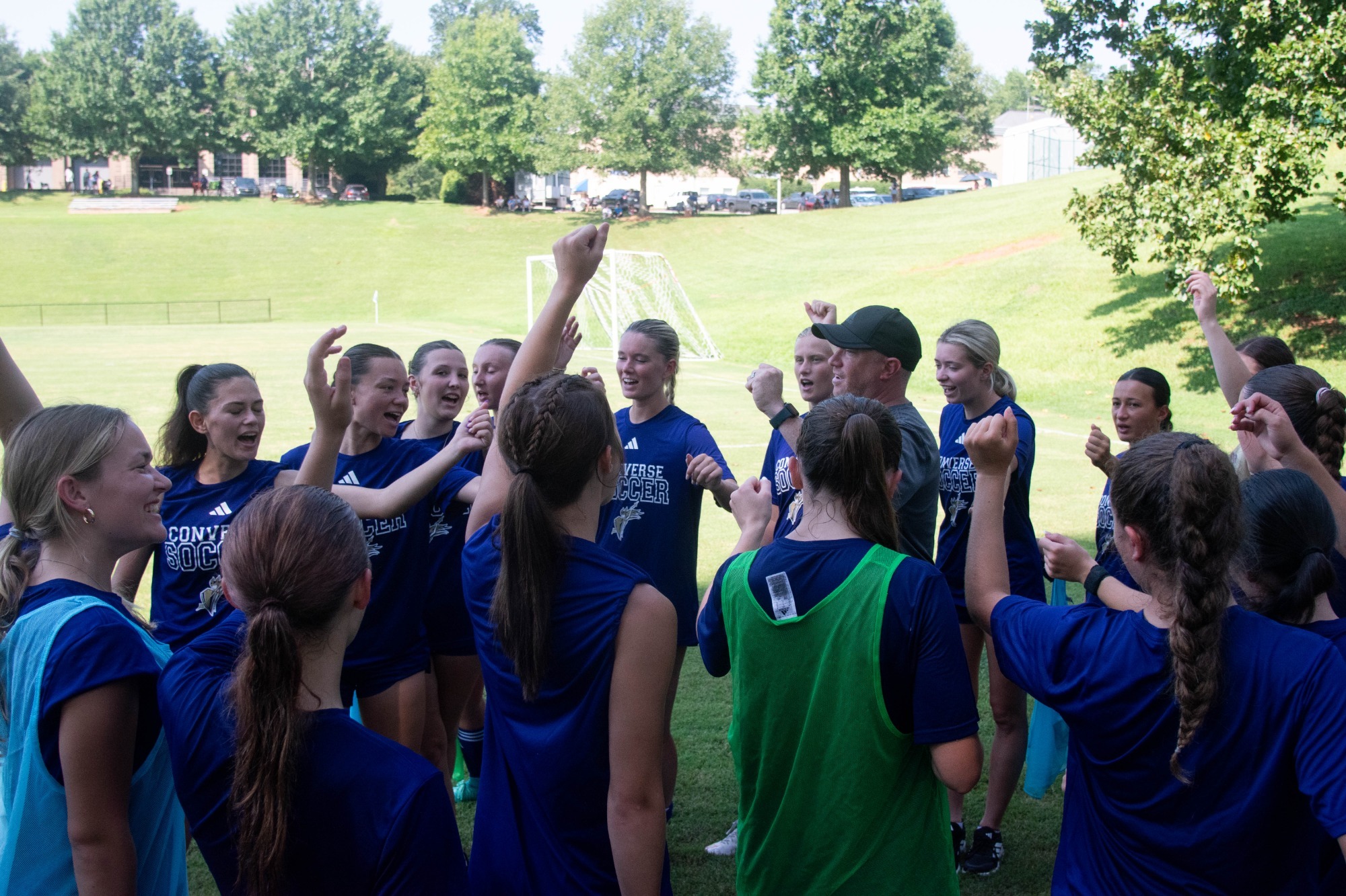 Women's soccer celebrates in a pregame huddle