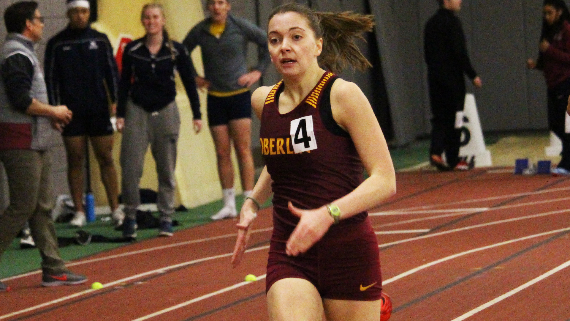 Christine Impara running on the indoor track