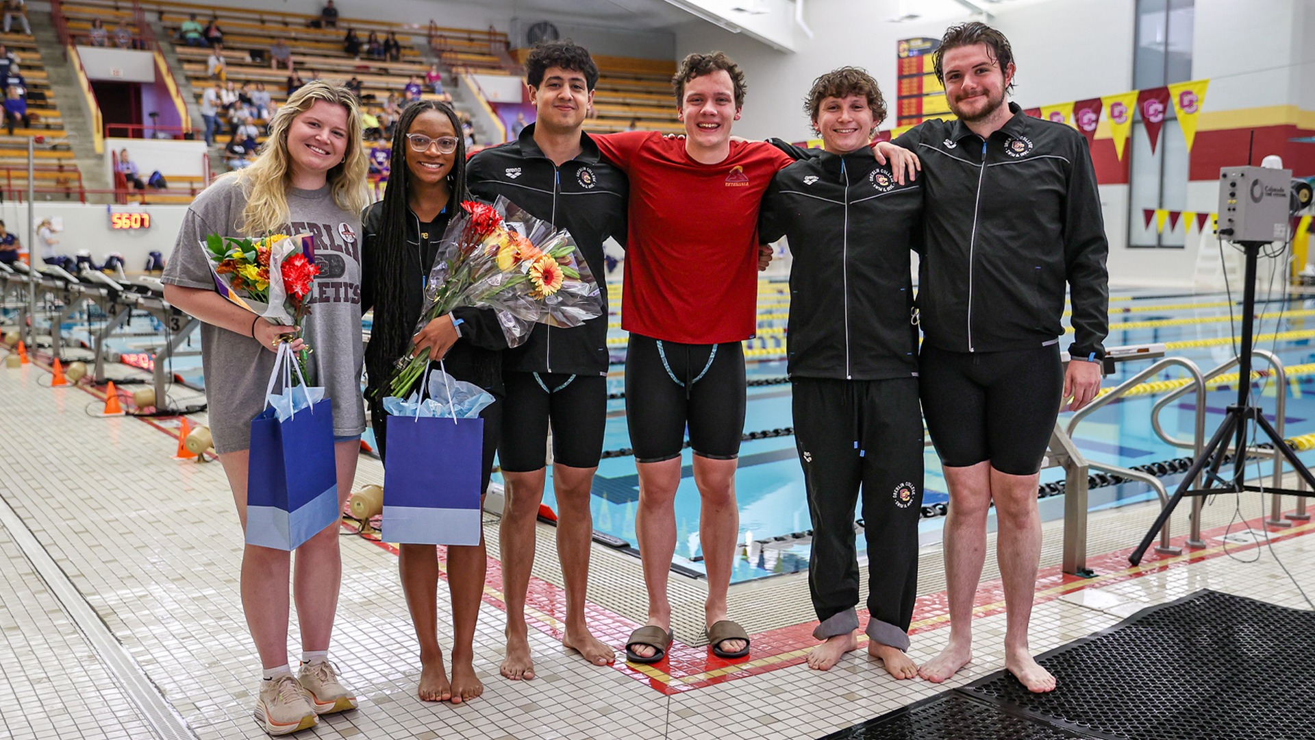 Swim and Dive seniors smile together