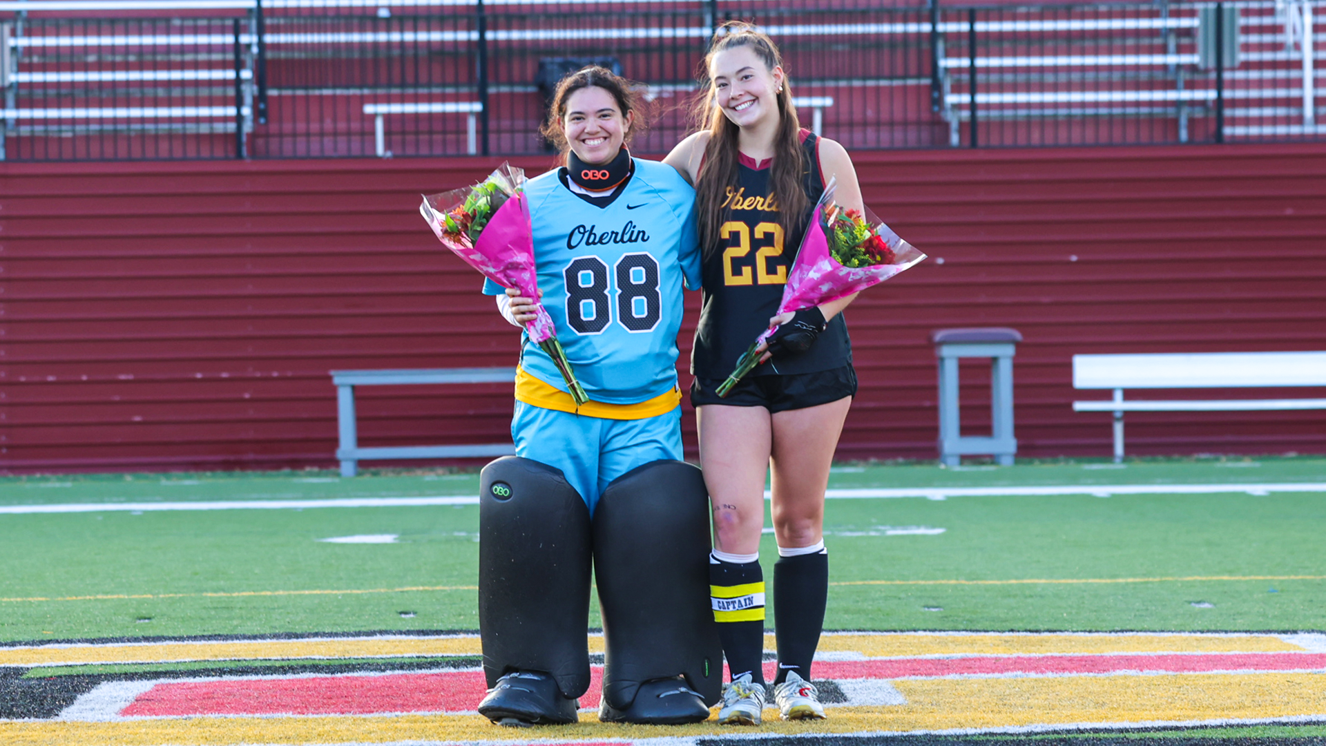 Elly Scheer and Janny McCormick Smiling on Senior Day