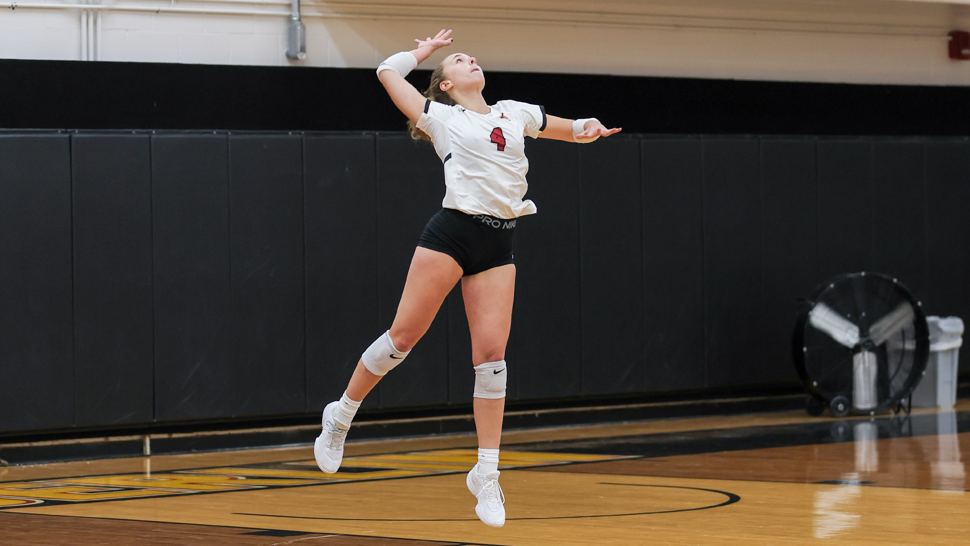 Josie Macdonald serving the ball